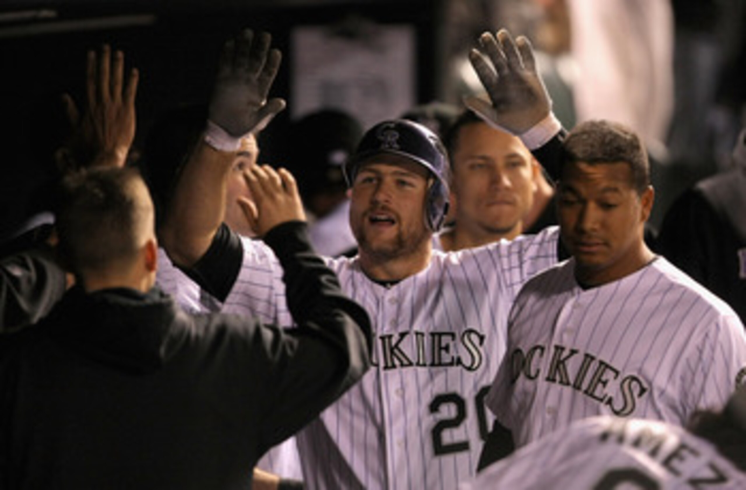 DENVER, CO - MAY 09: Cacther Chris Iannetta #20 of the Colorado Rockies celebrates in the dugout after his solo homerun off of starting pitcher Chris Capuano #38 of the New York Mets to give the Rockies a 2-1 lead in the seventh inning at Coors Field on DENVER, CO - MAY 09: Cacther Chris Iannetta #20 of the Colorado Rockies celebrates in the dugout after his solo homerun off of starting pitcher Chris Capuano #38 of the New York Mets to give the Rockies a 2-1 lead in the seventh inning at Coors Field on