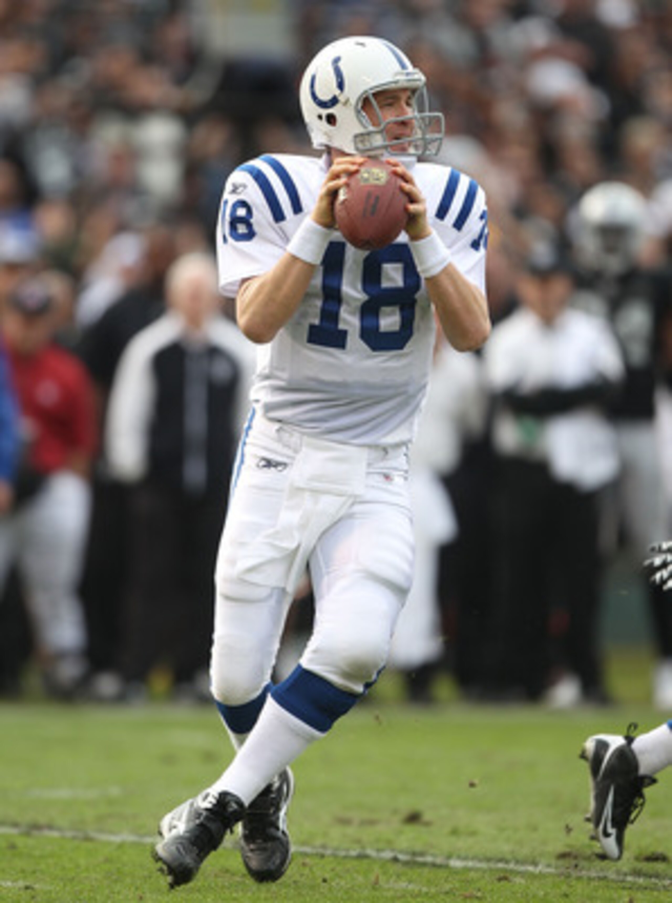 OAKLAND, CA - DECEMBER 26:  Peyton Manning #18 of the Indianapolis Colts passes against the Oakland Raiders during an NFL game at Oakland-Alameda County Coliseum on December  26, 2010 in Oakland, California.  (Photo by Jed Jacobsohn/Getty Images)
