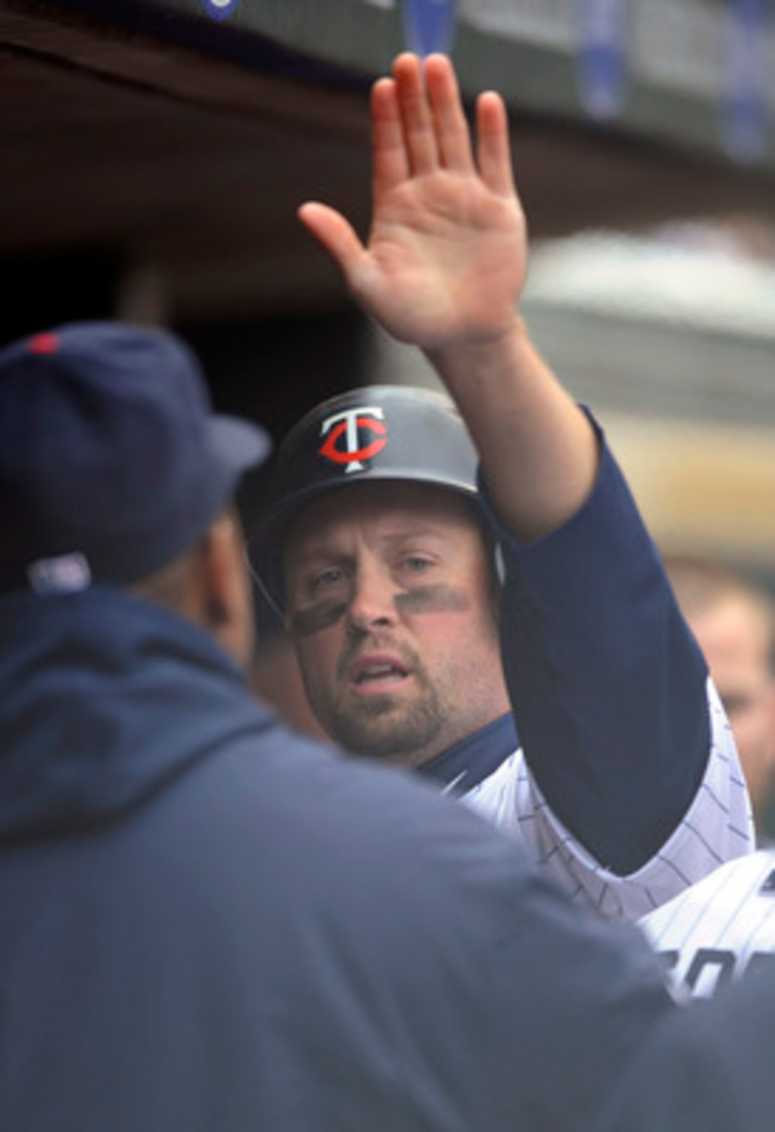 MINNEAPOLIS, MN - APRIL 28: Michael Cuddyer #5 of the Minnesota Twins celebrates scoring with his teammates during in the seventh inning of their game against the Tampa Bay Rays on April 28, 2011 at Target Field in Minneapolis, Minnesota. (Photo by Hannah