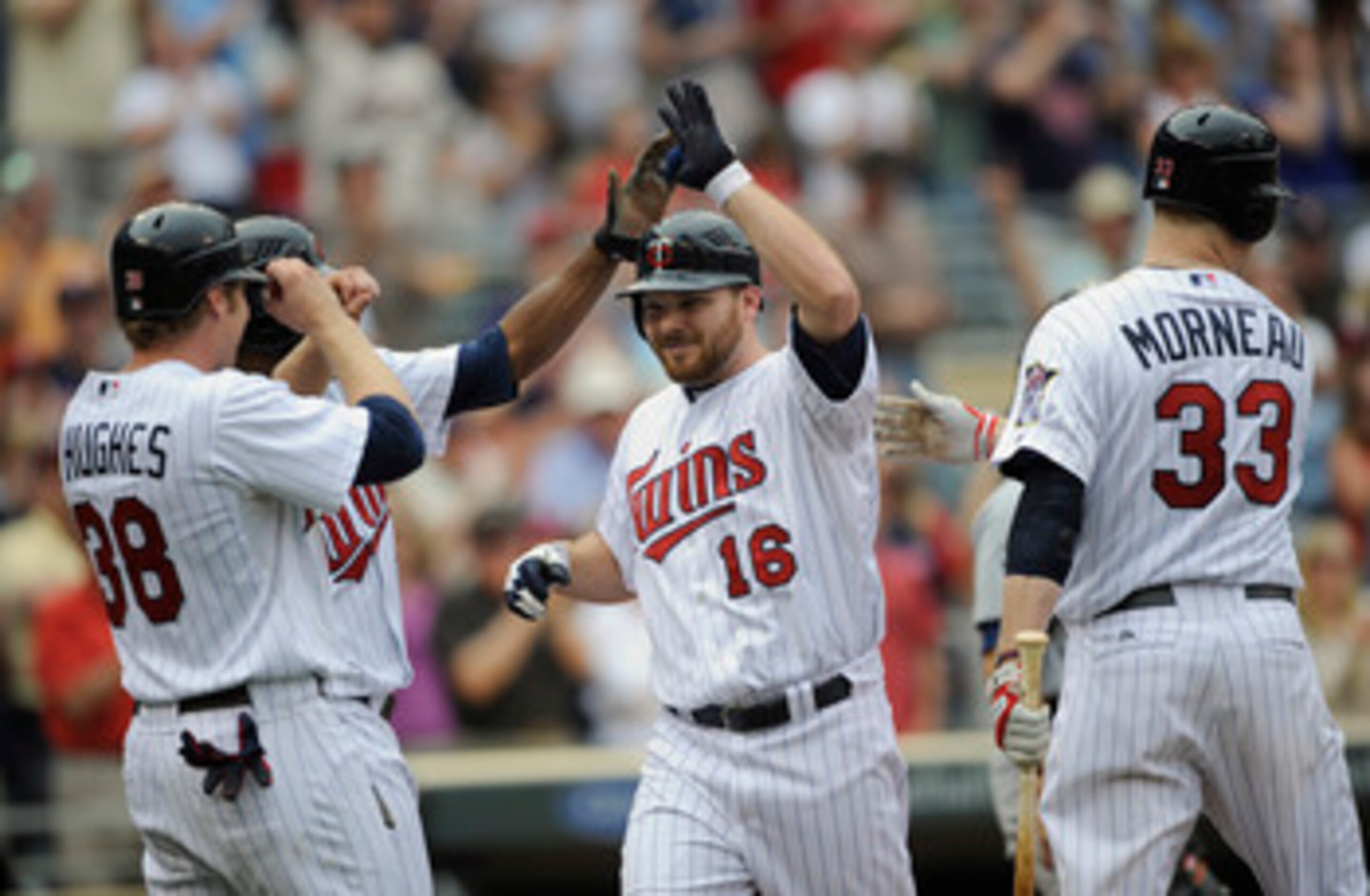 MINNEAPOLIS, MN - MAY 11: Luke Hughes #38, Denard Span #2, Jason Kubel #16 and Justin Morneau #33 of the Minnesota Twins celebrate a three-run home run by Kubel off Daniel Schlereth #55 of the Detroit Tigers during in the seventh inning of their game on M
