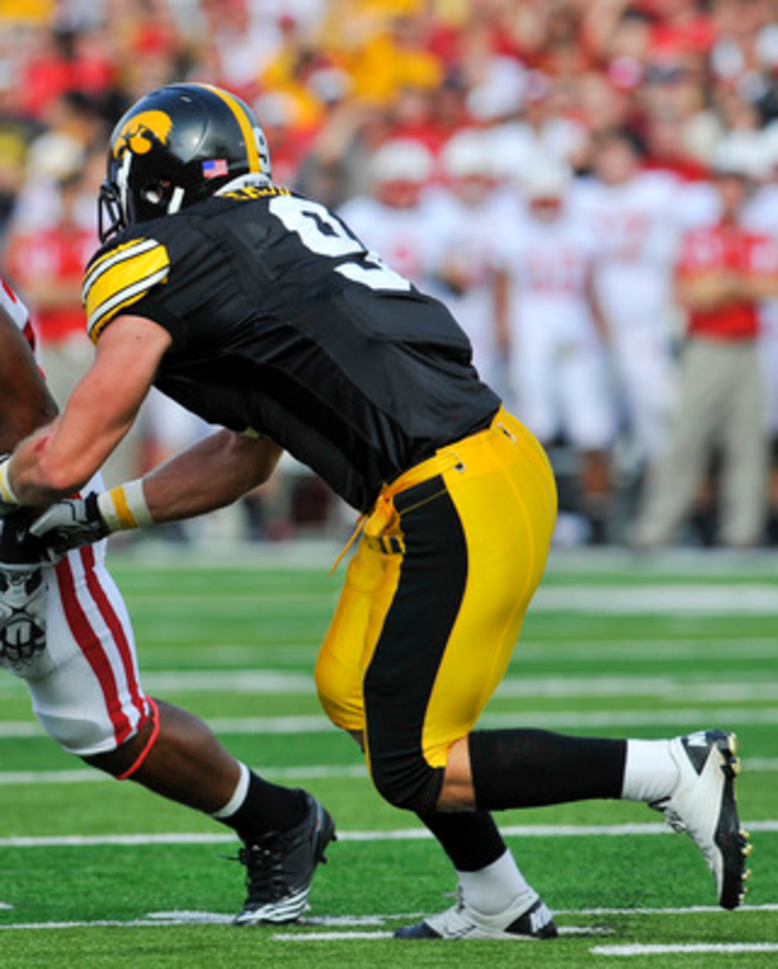 IOWA CITY, IA - OCTOBER 23: Defensive back Tyler Sash #9 of the University of Iowa Hawkeyes closes in on running back James White #20 of the Wisconsin Badgers as he rushes for yards during the first half of play at Kinnick Stadium on October 23, 2010 in I