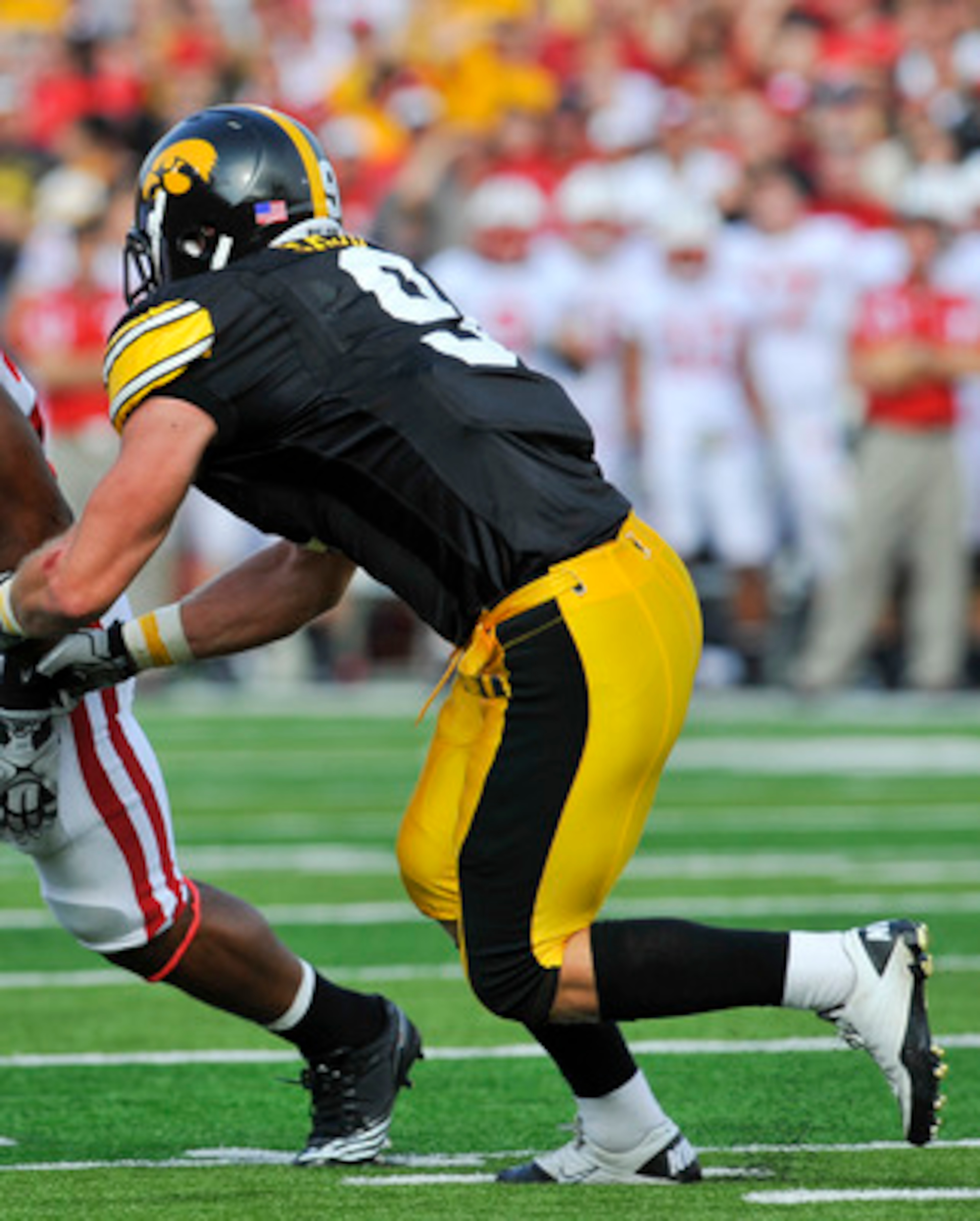 IOWA CITY, IA - OCTOBER 23: Defensive back Tyler Sash #9 of the University of Iowa Hawkeyes closes in on running back James White #20 of the Wisconsin Badgers as he rushes for yards during the first half of play at Kinnick Stadium on October 23, 2010 in I