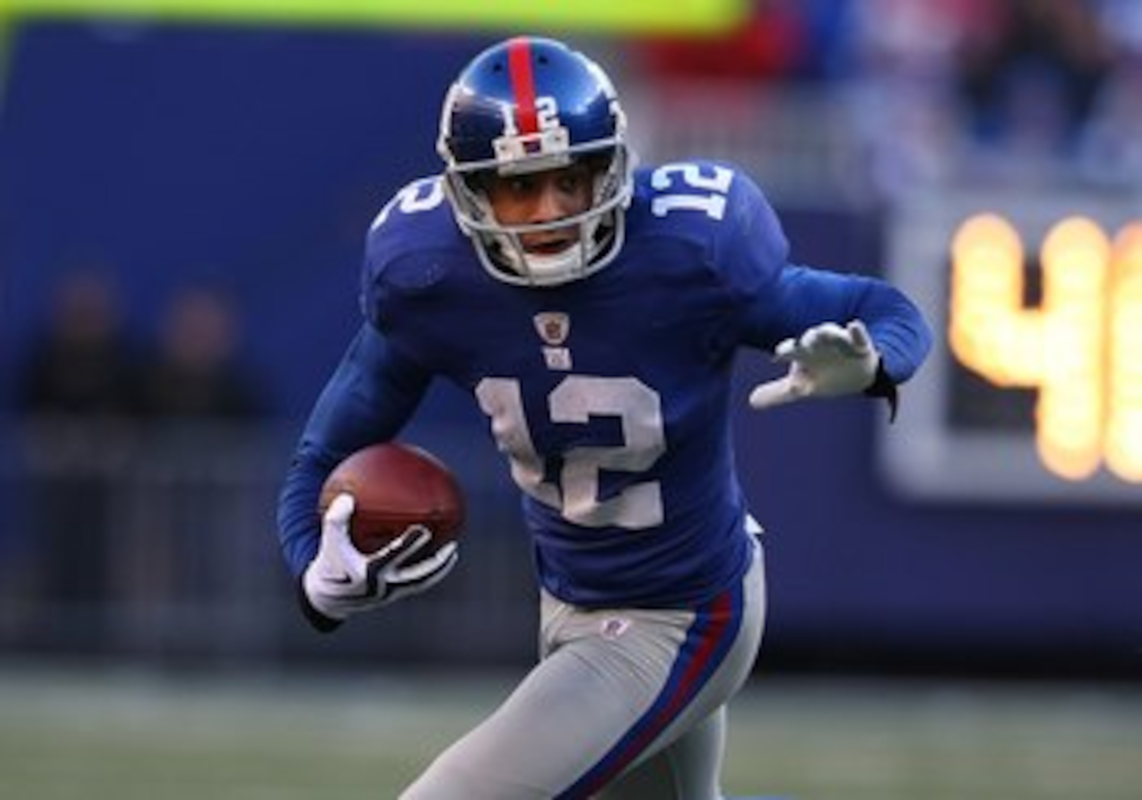 EAST RUTHERFORD, NJ - DECEMBER 27:  Steve Smith #12 of the New York Giants runs against the Carolina Panthers at Giants Stadium on December 27, 2009 in East Rutherford, New Jersey.  (Photo by Nick Laham/Getty Images)