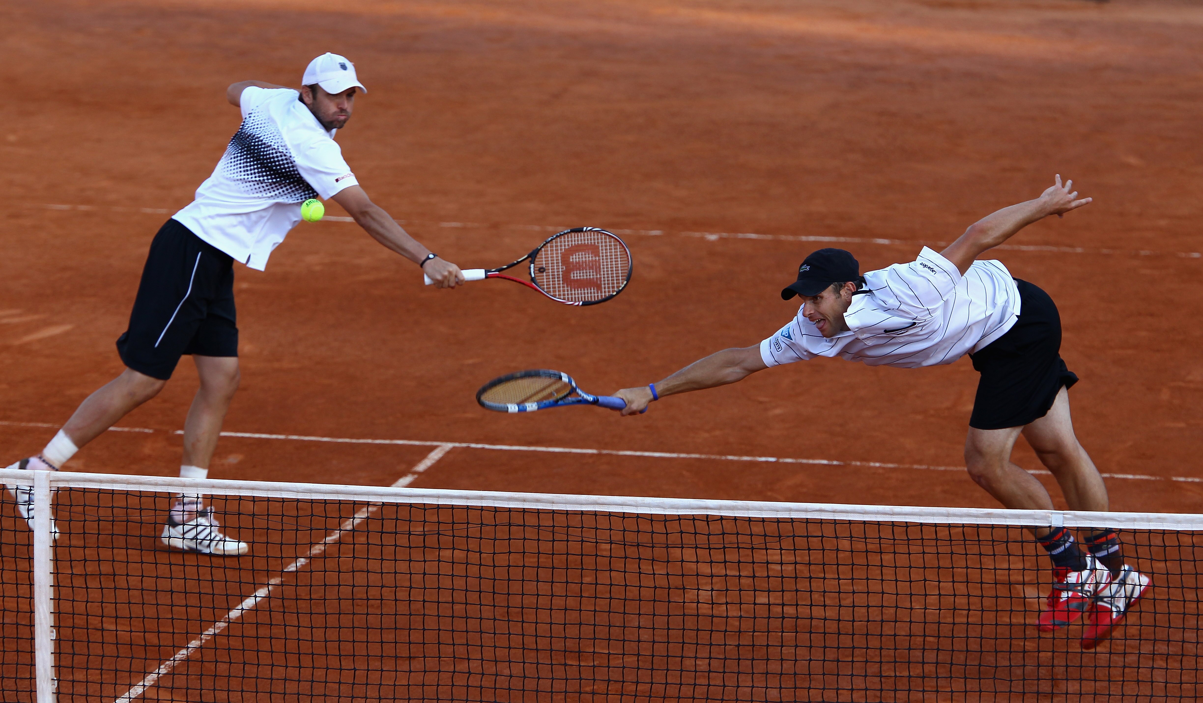 ROME, ITALY - MAY 14: Andy Roddick and Mardy Fish of the USA in action during their doubles semi final match against Carlos Berlocq of Argentina and Jarkko Nieminen of Finland during day seven of the Internazoinali BNL D'Italia at the Foro Italico Tennis ROME, ITALY - MAY 14: Andy Roddick and Mardy Fish of the USA in action during their doubles semi final match against Carlos Berlocq of Argentina and Jarkko Nieminen of Finland during day seven of the Internazoinali BNL D'Italia at the Foro Italico Tennis