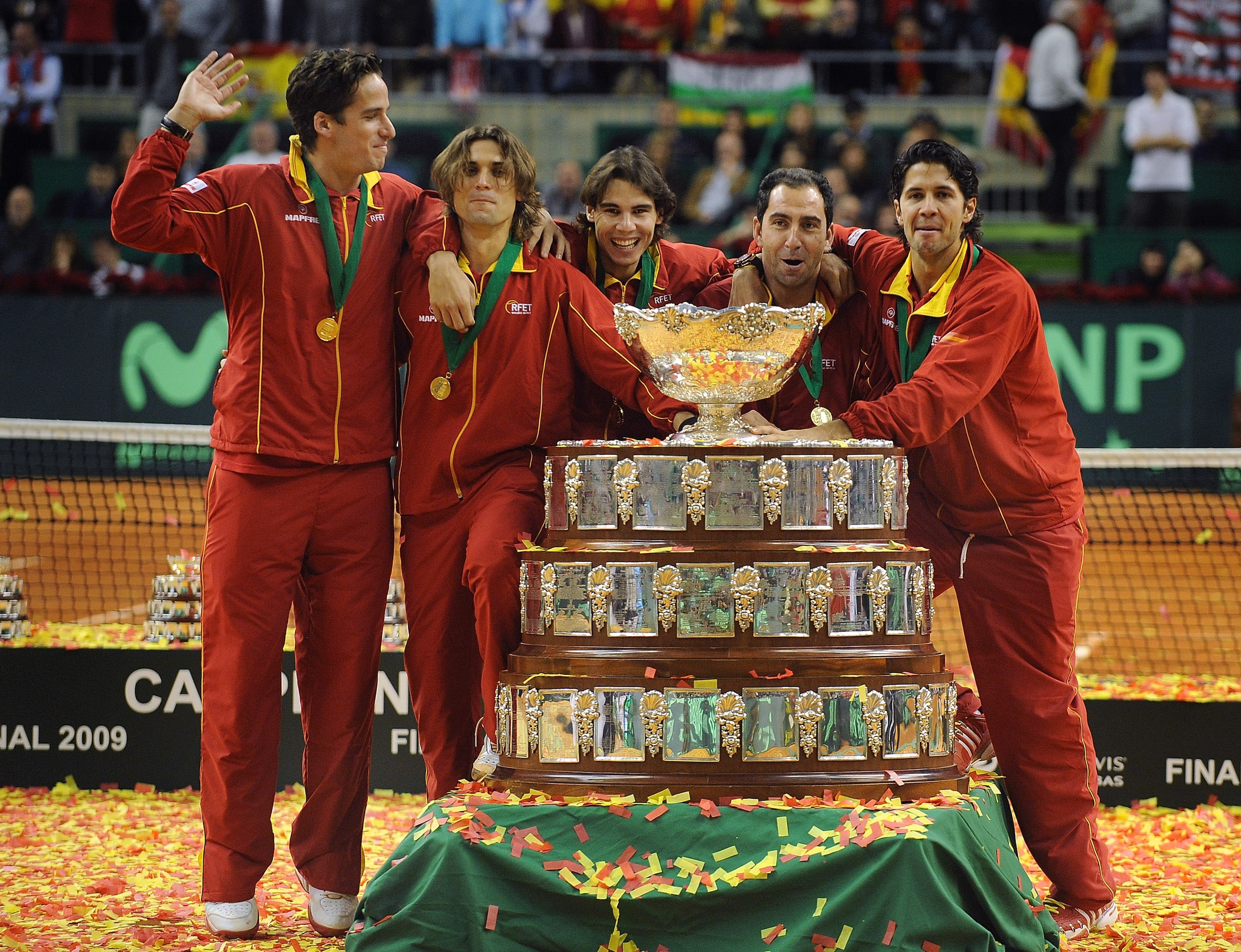 BARCELONA, SPAIN - DECEMBER 06:  Spanish players Feliciano Lopez (L), David Ferrer (C), Rafael Nadal, team captain Albert Costa and Fernando Verdasco celebrate with the Davis Cup trophy at the end of the final match between Spain and Czech Republic at the