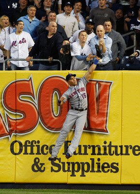 NEW YORK - MAY 20:  Mark Teixeira #25 of the New York Yankees (not pictured) hits a home run just over the leap of Carlos Beltran #15 of the New York Mets in the bottom of the third on May 20, 2011 at Yankee Stadium in the Bronx borough of New York City. 