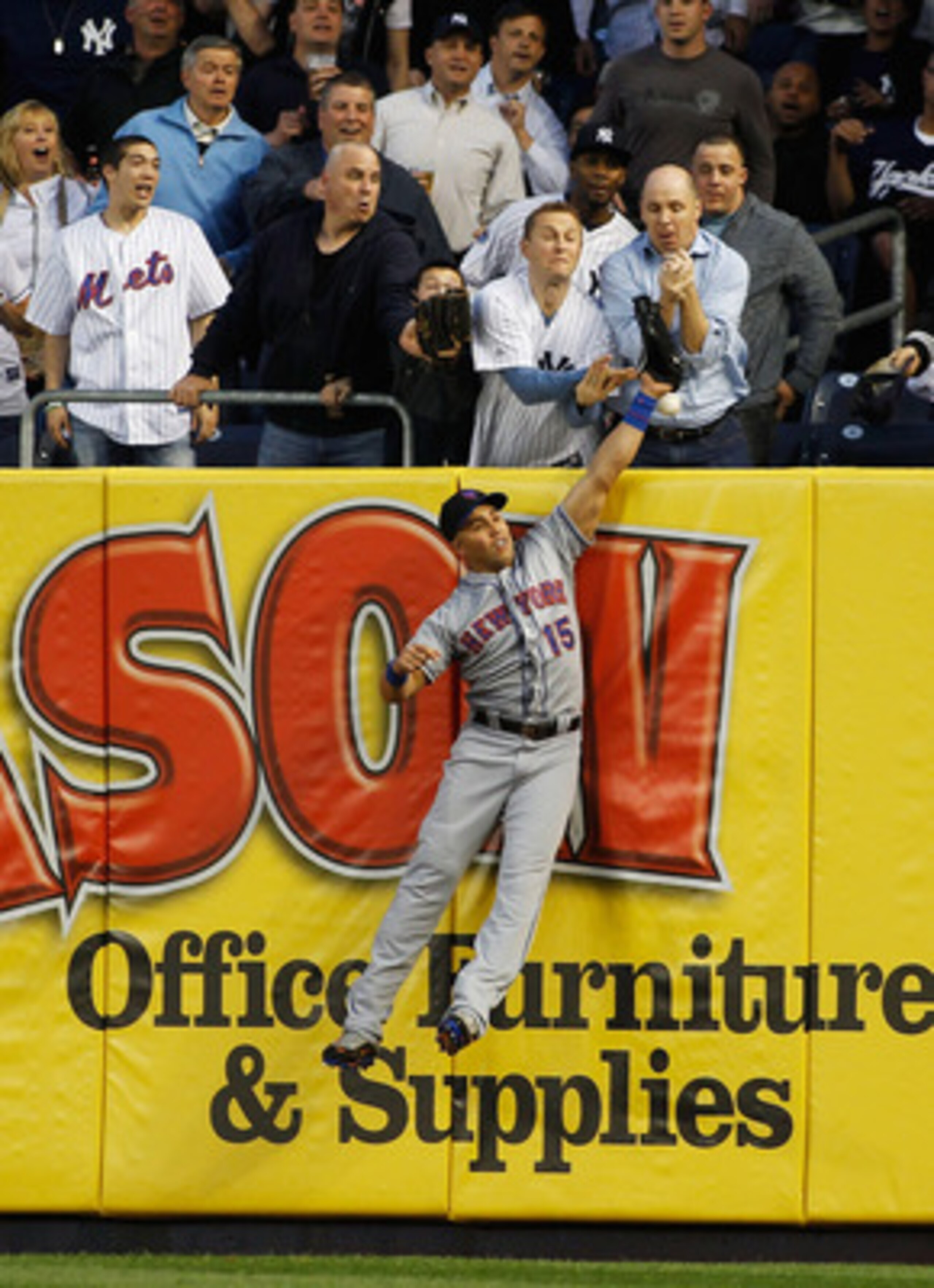 NEW YORK - MAY 20:  Mark Teixeira #25 of the New York Yankees (not pictured) hits a home run just over the leap of Carlos Beltran #15 of the New York Mets in the bottom of the third on May 20, 2011 at Yankee Stadium in the Bronx borough of New York City. 