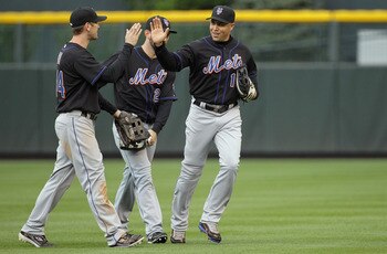 DENVER, CO - MAY 12:  Outfielders Jason Bay #44, Jason Pridie #20 and Carlos Beltran #15 of the New York Mets celebrate their 9-5 victory over the Colorado Rockies at Coors Field on May 12, 2011 in Denver, Colorado.  (Photo by Doug Pensinger/Getty Images)