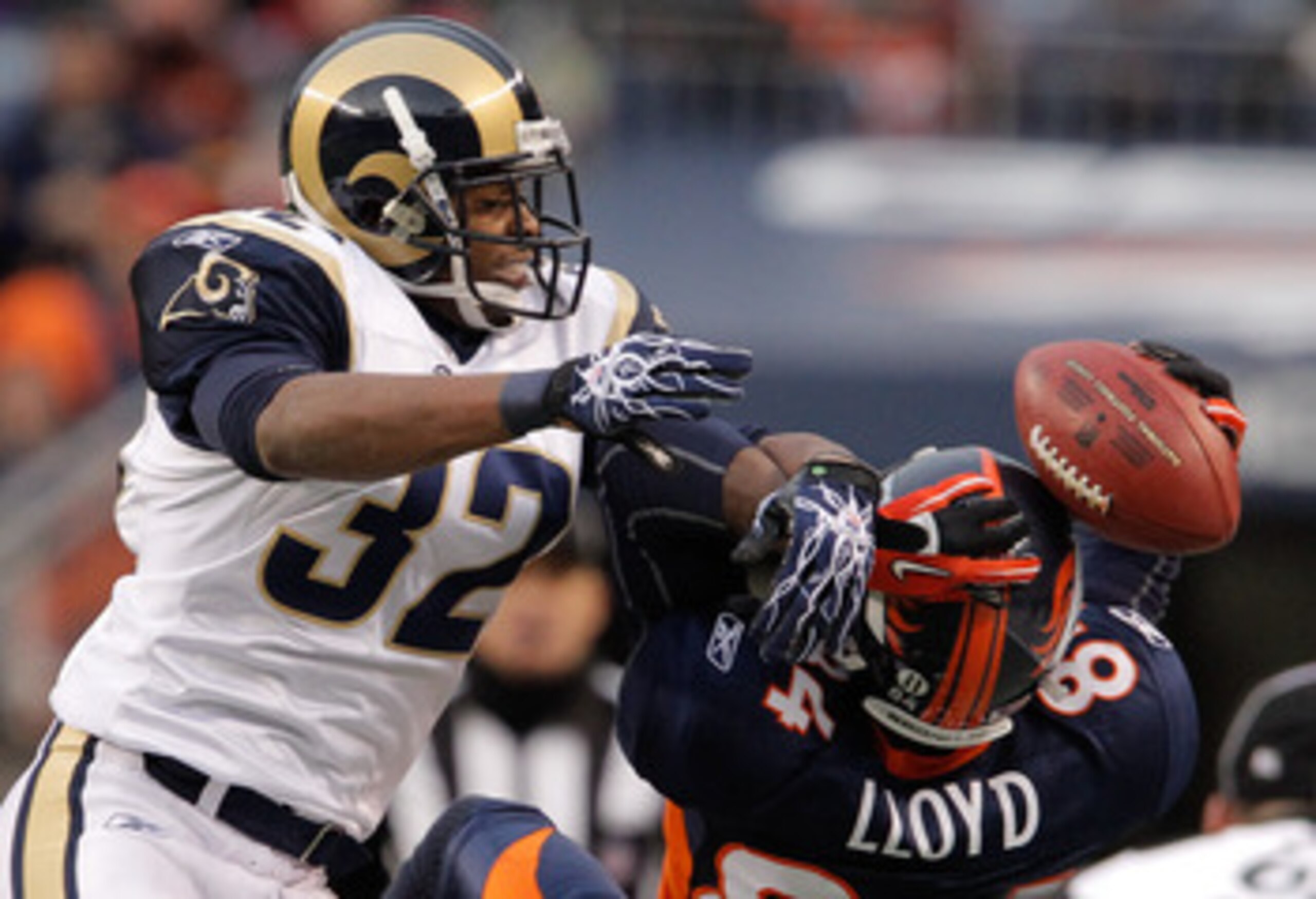 DENVER - NOVEMBER 28:  Corner back Bradley Fletcher #32 of the St. Louis Rams breaks up a pass intended for wide receiver Brandon Lloyd #84 of the Denver Broncos in the second quarter at INVESCO Field at Mile High on November 28, 2010 in Denver, Colorado.