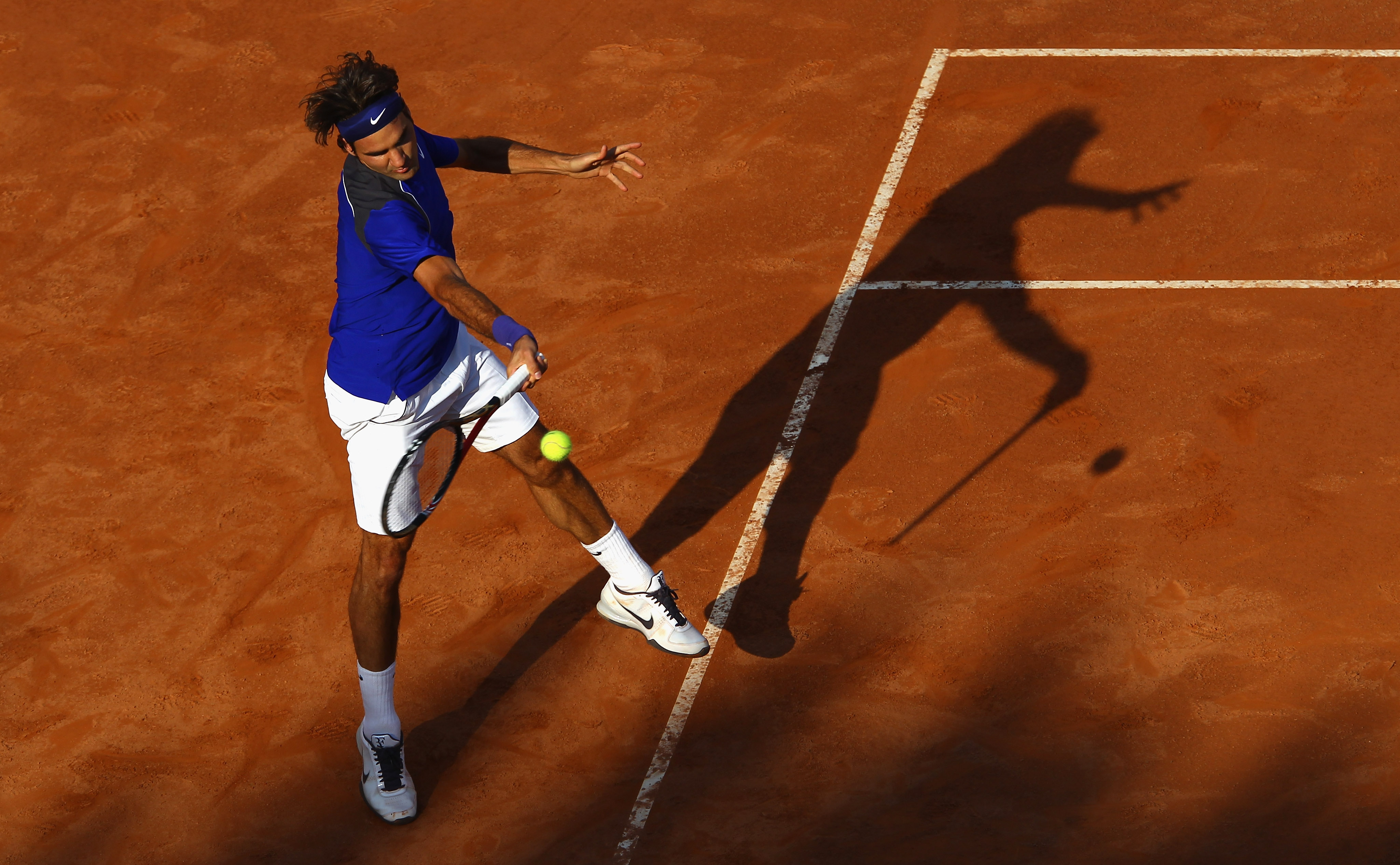 ROME, ITALY - MAY 12: Roger Federer of Switzerland plays a forehand during his third round match against Richard Gasquet of France during day five of the Internazoinali BNL D'Italia at the Foro Italico Tennis Centre on May 12, 2011 in Rome, Italy. (Phot ROME, ITALY - MAY 12: Roger Federer of Switzerland plays a forehand during his third round match against Richard Gasquet of France during day five of the Internazoinali BNL D'Italia at the Foro Italico Tennis Centre on May 12, 2011 in Rome, Italy. (Phot