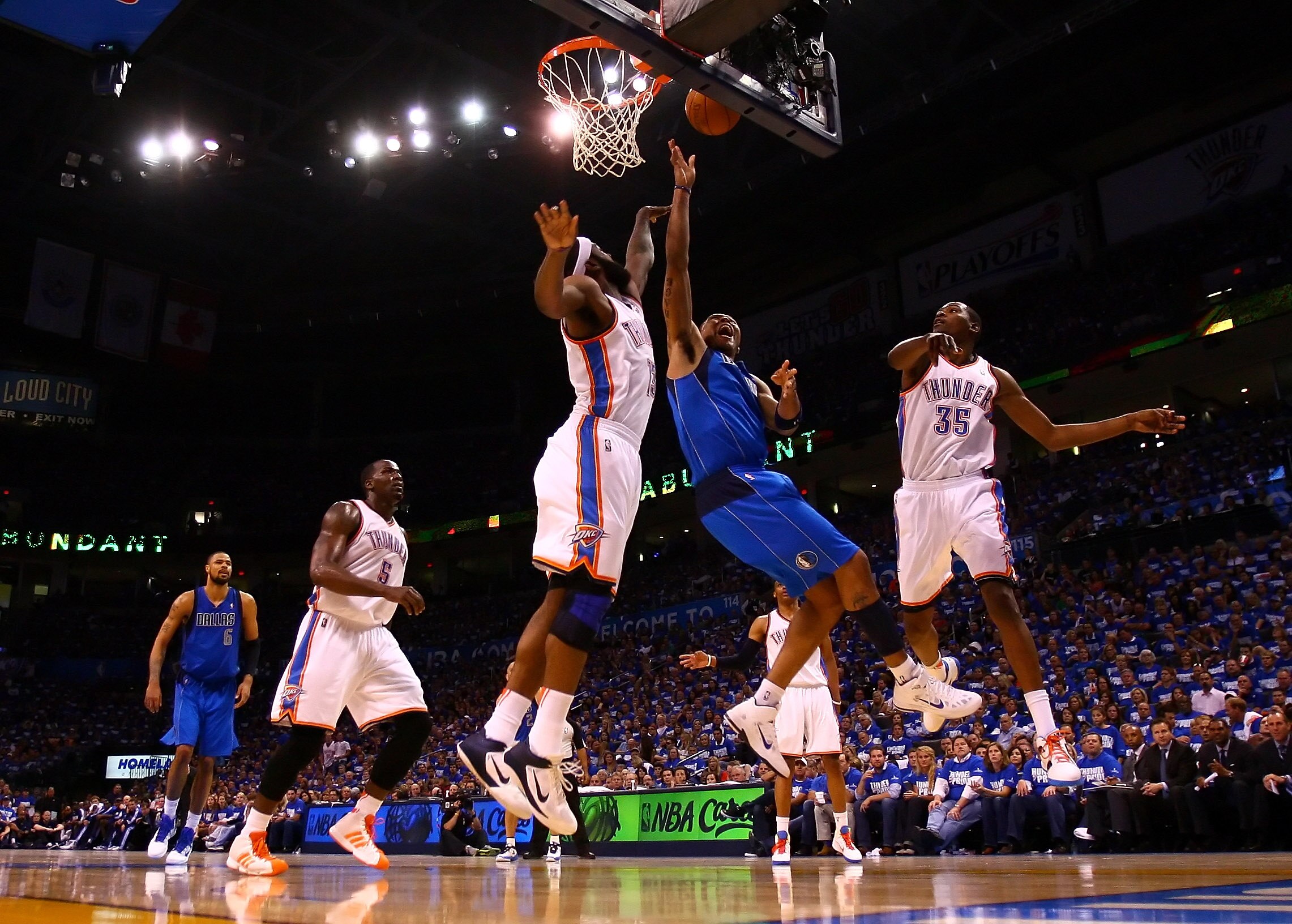 OKLAHOMA CITY, OK - MAY 21:  Shawn Marion #0 of the Dallas Mavericks goes up for a shot against James Harden #13 and Kevin Durant #35 of the Oklahoma City Thunder in Game Three of the Western Conference Finals during the 2011 NBA Playoffs at Oklahoma City