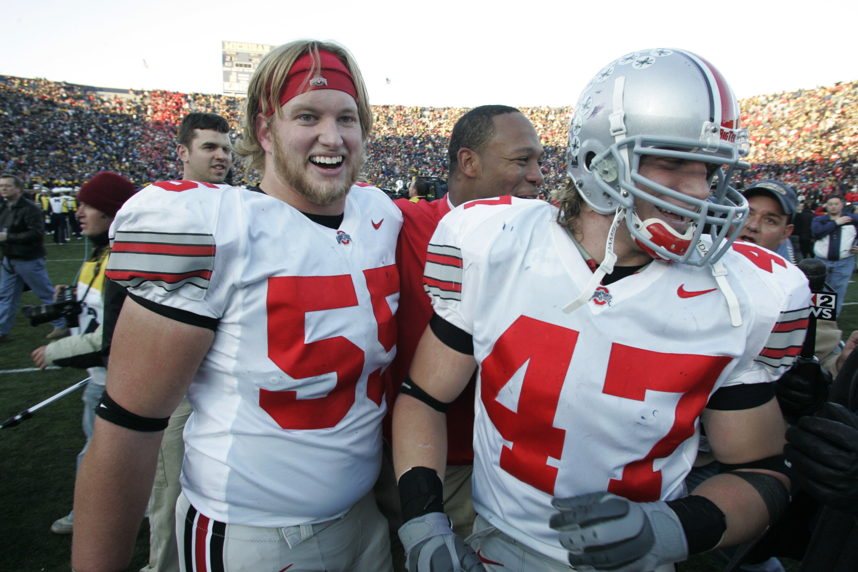ANN ARBOR, MI - NOVEMBER 19:  Nick Mangold #55 and A.J. Hawk #47 of Ohio State celebrate after defeating Michigan on November 19, 2005 at Michigan Stadium in Ann Arbor, Michigan. The Buckeyes defeated the Wolverines 25-21.  (Photo by Tom Pidgeon/Getty Ima