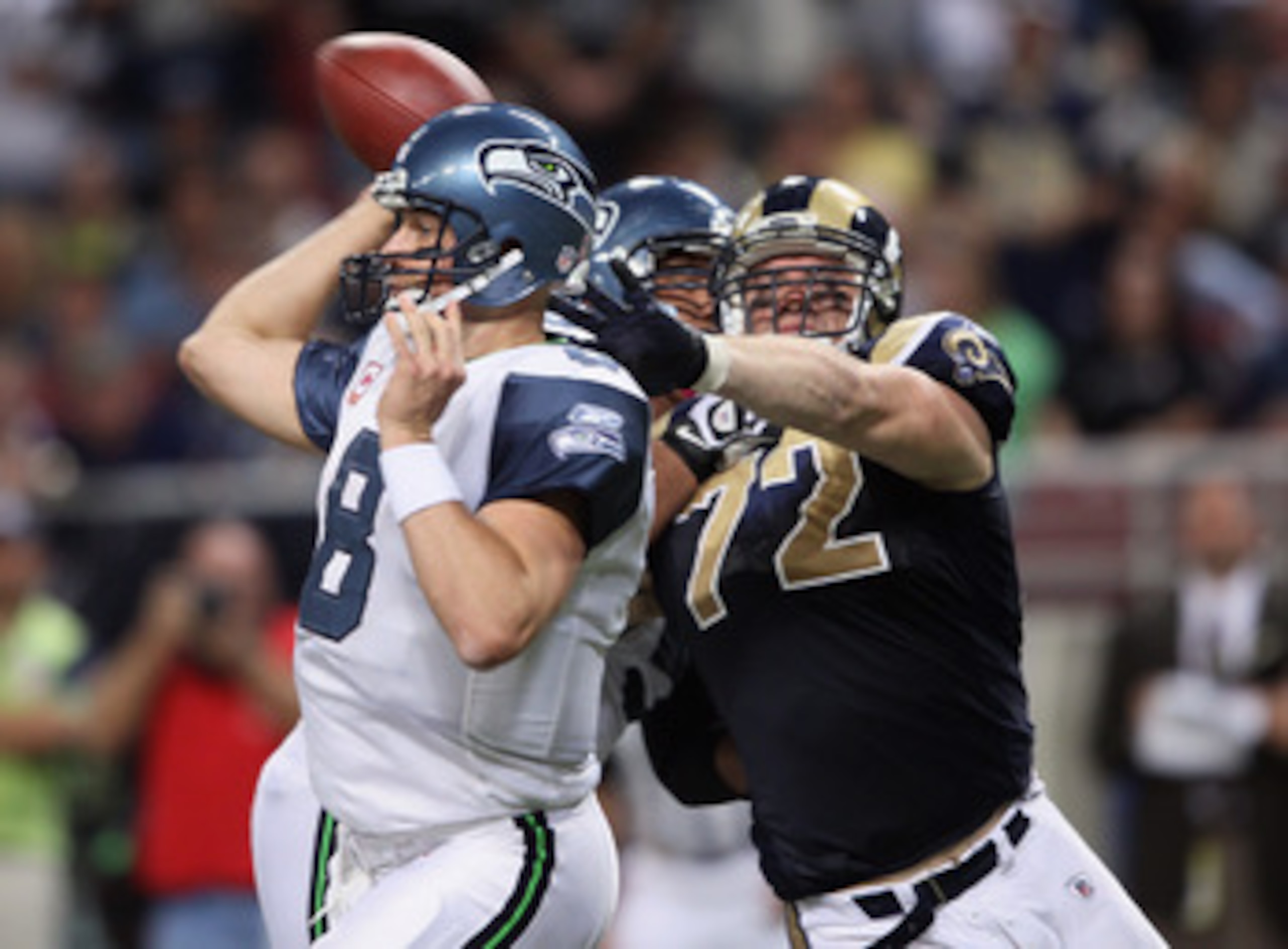 ST. LOUIS - OCTOBER 03:  Chris Long #72 of the St. Louis Rams pressures Matt Hasselbeck #8 of the Seattle Seahawks on October 3, 2010 at Edward Jones Dome in St. Louis, Missouri. The Rams defeated the Seahawks 20-3.  (Photo by Elsa/Getty Images)