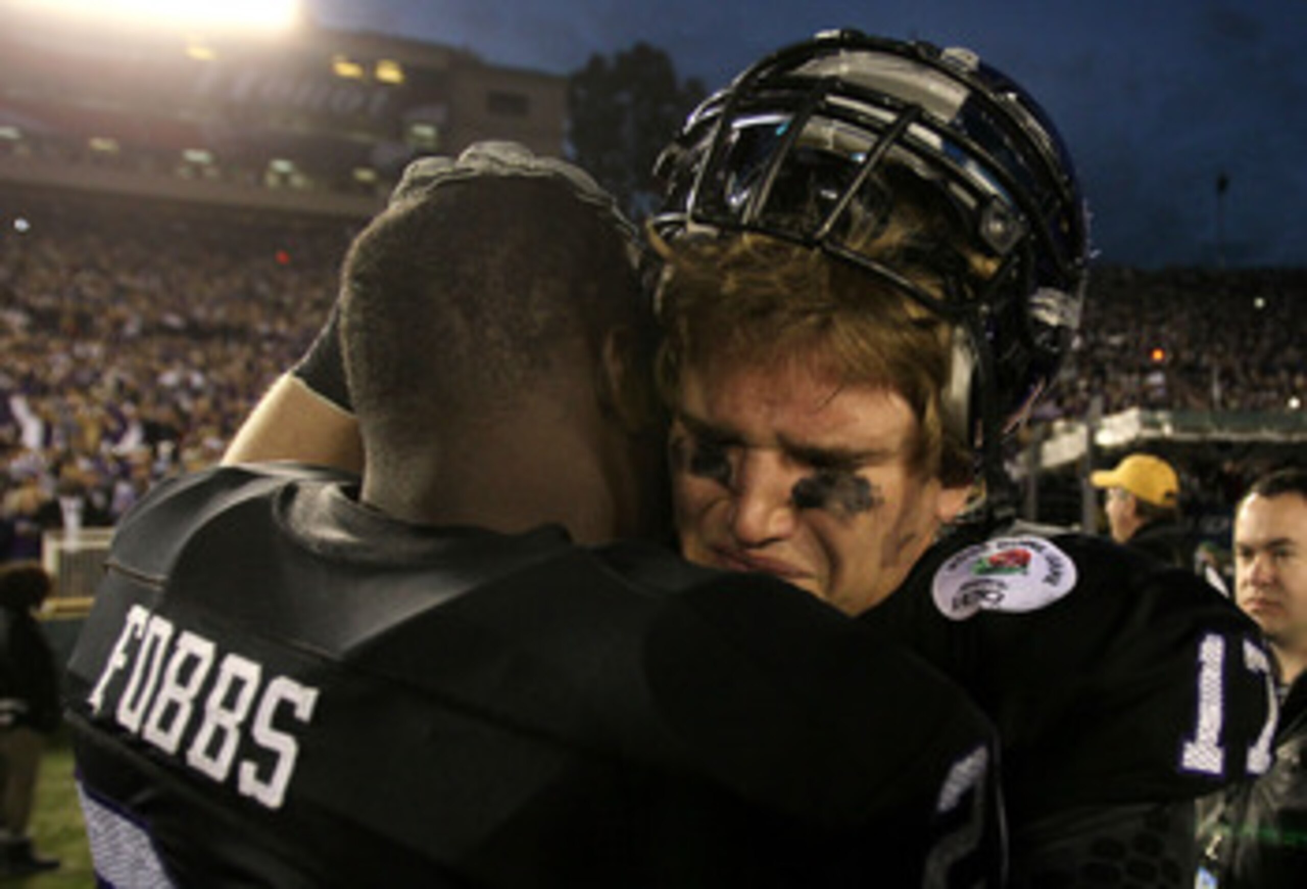 PASADENA, CA - JANUARY 01:  Safety Tyler Luttrell #17 of the TCU Horned Frogs celebrates with Johnny Fobbs #21 in the final moments of their 21-19 win over the Wisconsin Badgers in the 97th Rose Bowl game on January 1, 2011 in Pasadena, California.  (Phot