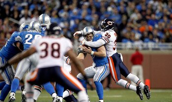 DETROIT - DECEMBER 05: Drew Stanton #5 of the Detroit Lions is sacked by D. J. Moore #30 of the Chicago Bears during the fourth quarter of the game at Ford Field on December 5, 2010 in Detroit, Michigan. The Bears defeated the Lions 24-20.  (Photo by Leon