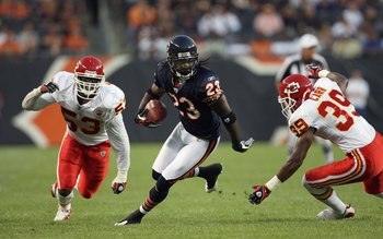 CHICAGO - AUGUST 7:  Devin Hester #23 of the Chicago Bears carries the ball against Demorrio Williams #53 and Brandon Carr #39 of the Kansas City Chiefs during a preseason game on August 7, 2008 at Soldier Field in Chicago, Illinois. (Photo by Jonathan Da