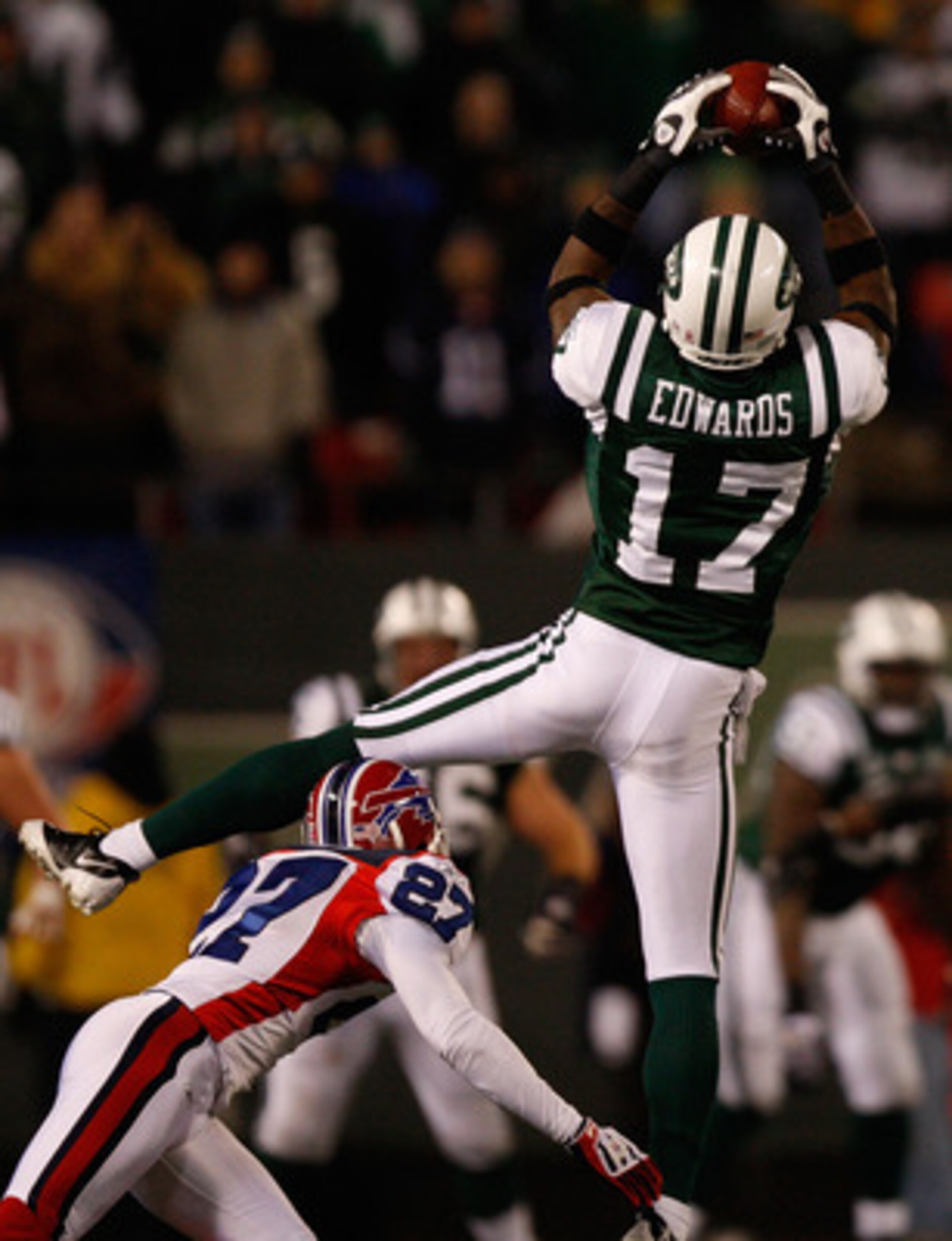 EAST RUTHERFORD, NJ - OCTOBER 18: Braylon Edwards #17 of the New York Jets makes a catch over Reggie Corner #27 of the Buffalo Bills during overtime on October 18, 2009 at Giants Stadium in East Rutherford, New Jersey. (Photo by Jared Wickerham/Getty Imag