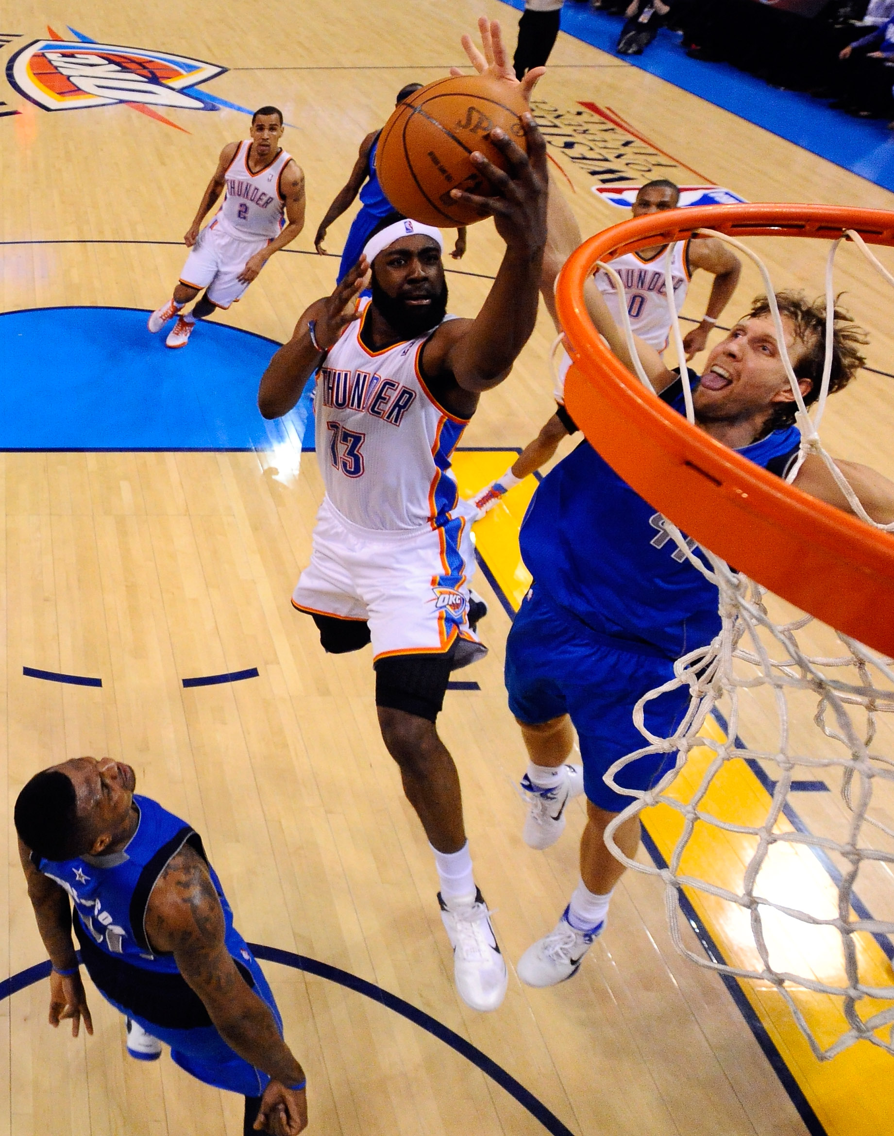 OKLAHOMA CITY, OK - MAY 21:  James Harden #13 of the Oklahoma City Thunder goes up for a shot against Dirk Nowitzki #41 of the Dallas Mavericks in the second half in Game Three of the Western Conference Finals during the 2011 NBA Playoffs at Oklahoma City