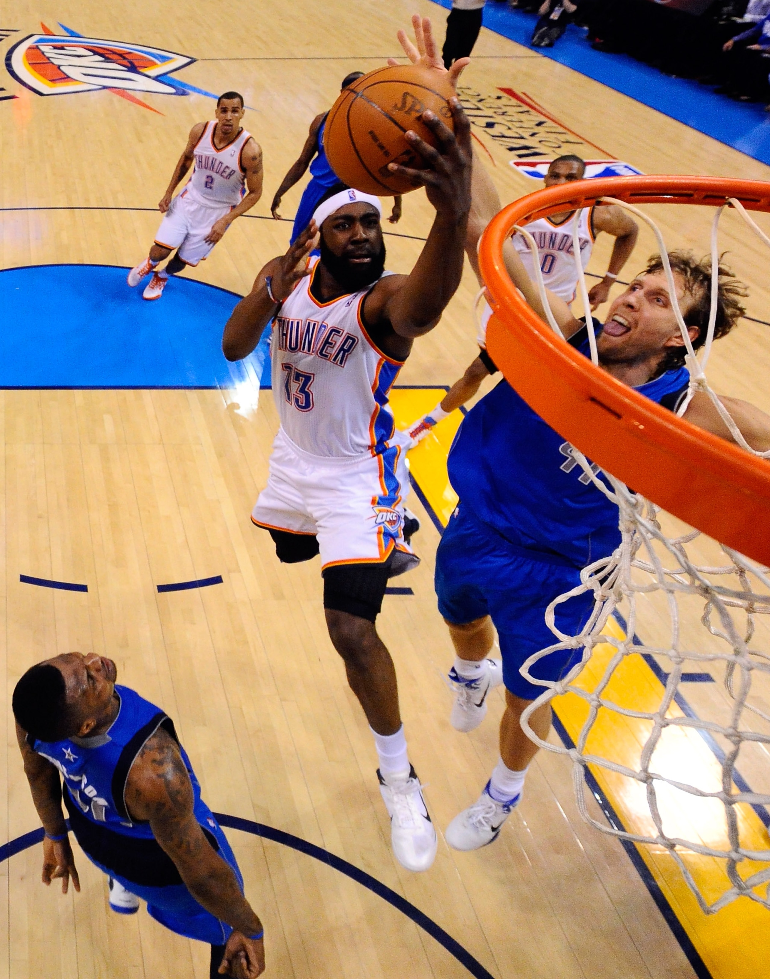 OKLAHOMA CITY, OK - MAY 21:  James Harden #13 of the Oklahoma City Thunder goes up for a shot against Dirk Nowitzki #41 of the Dallas Mavericks in the second half in Game Three of the Western Conference Finals during the 2011 NBA Playoffs at Oklahoma City