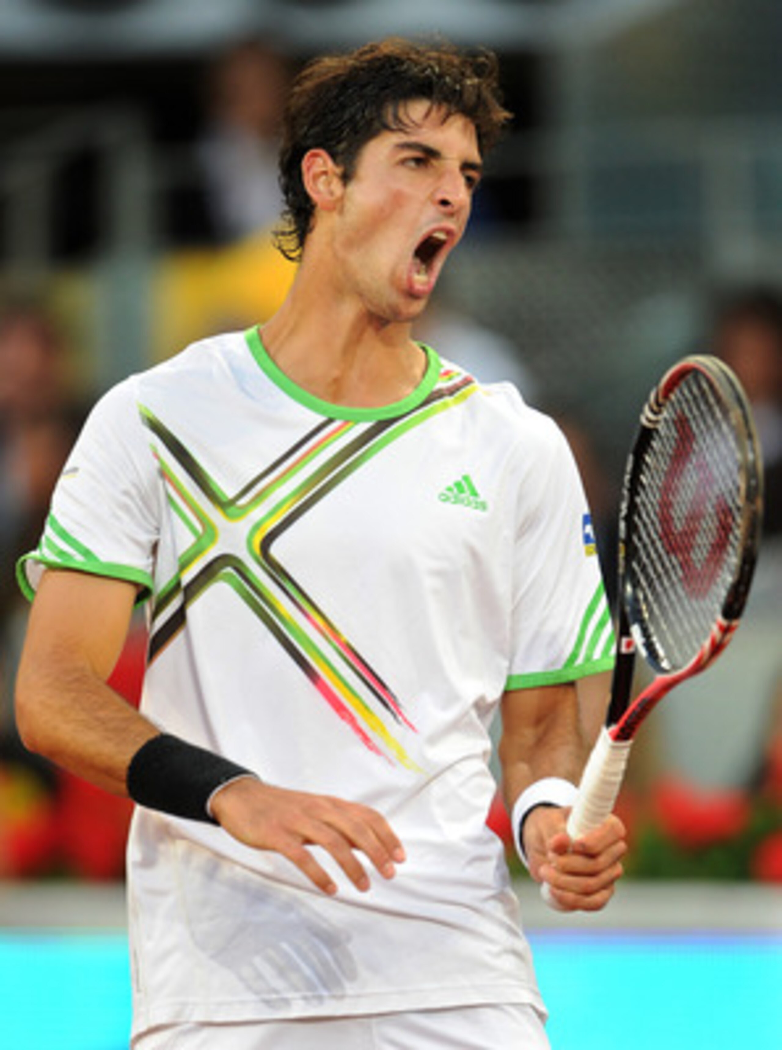 MADRID, SPAIN - MAY 07:  Thomaz Bellucci of Brazil reacts in his semi final match against Novak Djokovic of Serbia during day seven of the Mutua Madrilena Madrid Open Tennis on May 7, 2011 in Madrid, Spain.  (Photo by Jasper Juinen/Getty Images)