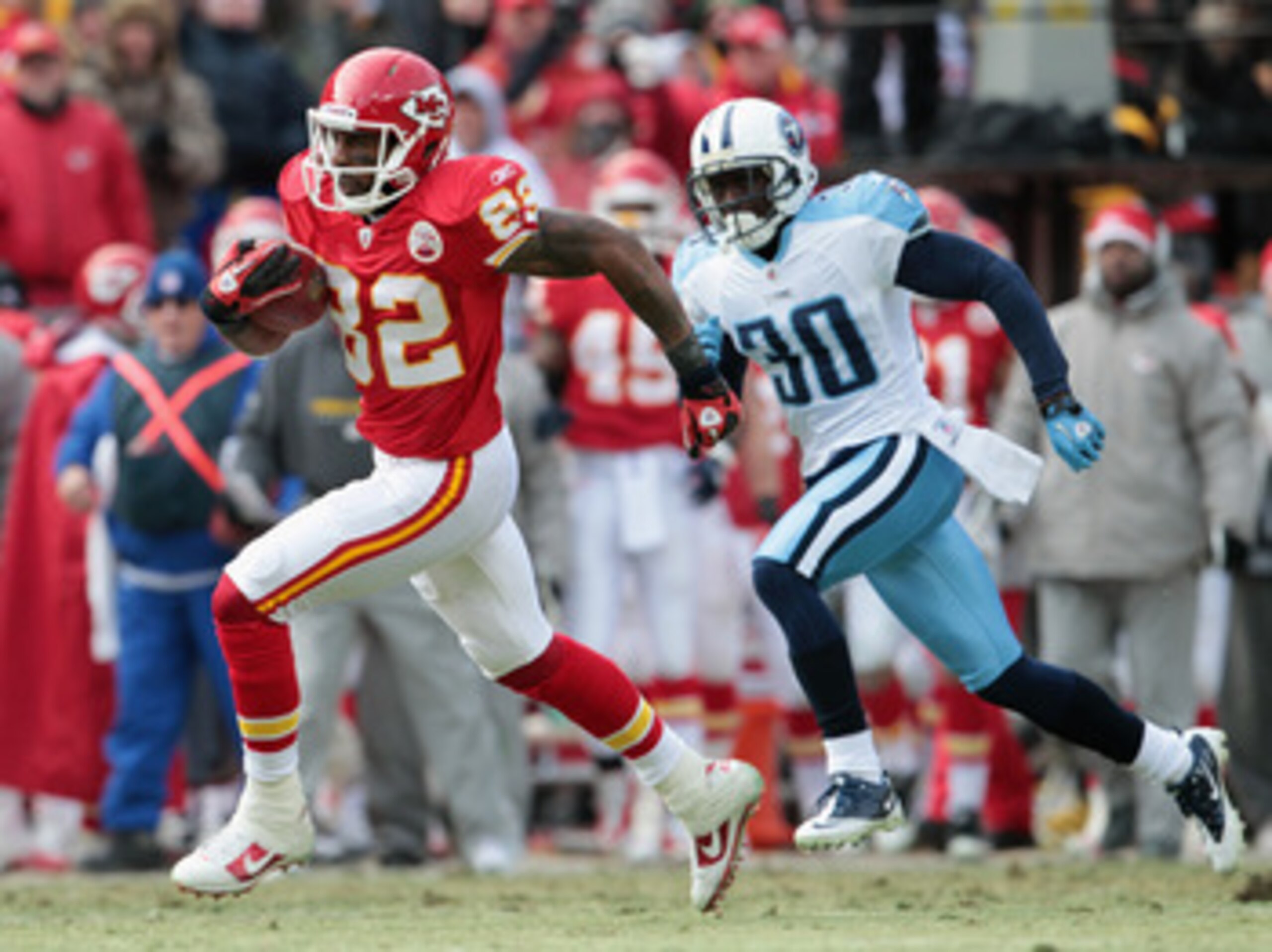 KANSAS CITY, MO - DECEMBER 26:  Receiver Dwayne Bowe #82 of the Kansas City Chiefs outruns Jason McCourty #30 of the Tennessee Titans after making a catch on a 75 yard touchdown play during the game on December 26, 2010 at Arrowhead Stadium in Kansas City