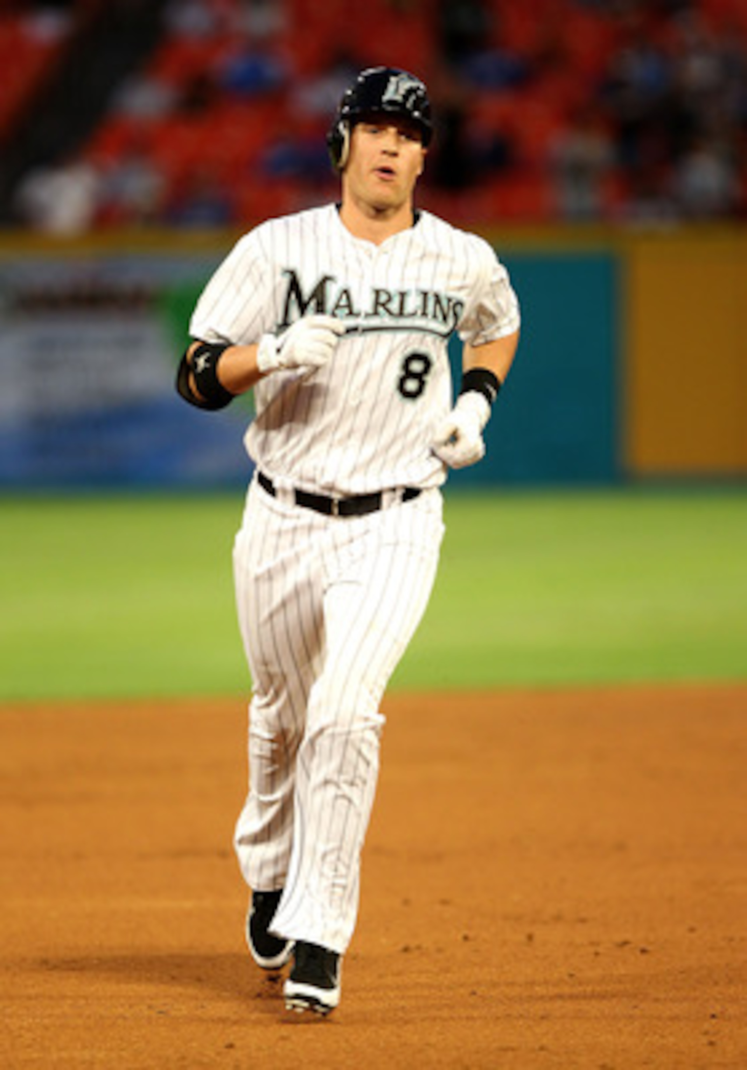 MIAMI GARDENS, FL - APRIL 25:  Chris Coghlan #8 of the Florida Marlins rounds second after hitting a solo HR during a game against the Los Angeles Dodgers at Sun Life Stadium on April 25, 2011 in Miami Gardens, Florida.  (Photo by Mike Ehrmann/Getty Image