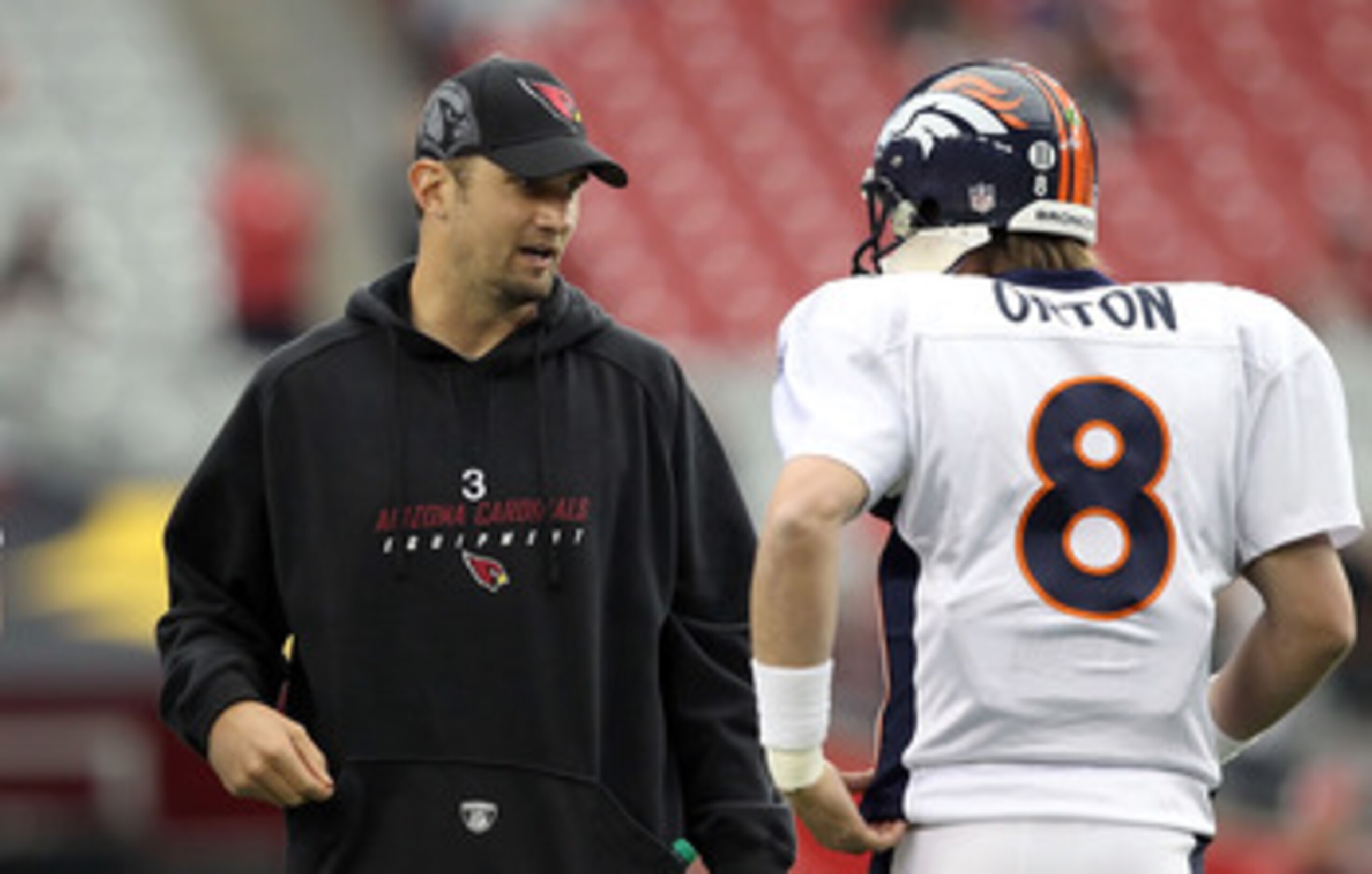 GLENDALE, AZ - DECEMBER 12:  Quarterbacks Derek Anderson #3 of the Arizona Cardinals talks with Kyle Orton #8 of the Denver Broncos before the NFL game at the University of Phoenix Stadium on December 12, 2010 in Glendale, Arizona. The Cardinals defeated 