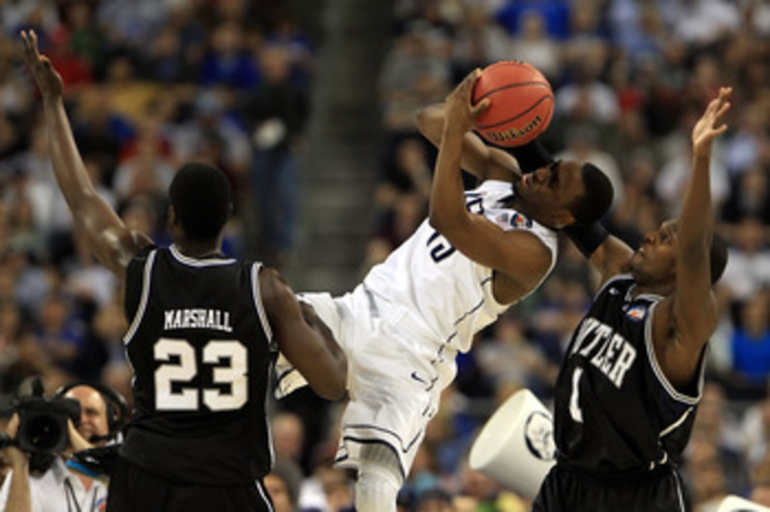 HOUSTON, TX - APRIL 04:  Kemba Walker #15 of the Connecticut Huskies fights for the ball agianst Shelvin Mack #1 and Khyle Marshall #23 of the Butler Bulldogs during the National Championship Game of the 2011 NCAA Division I Men's Basketball Tournament at