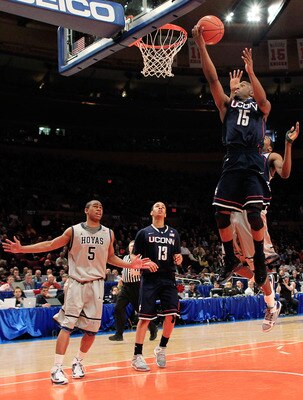 NEW YORK, NY - MARCH 09:  Kemba Walker #15 of the Connecticut Huskies lays the ball up against the Georgetown Hoyas during the second round of the 2011 Big East Men's Basketball Tournament presented by American Eagle Outfitters at Madison Square Garden on