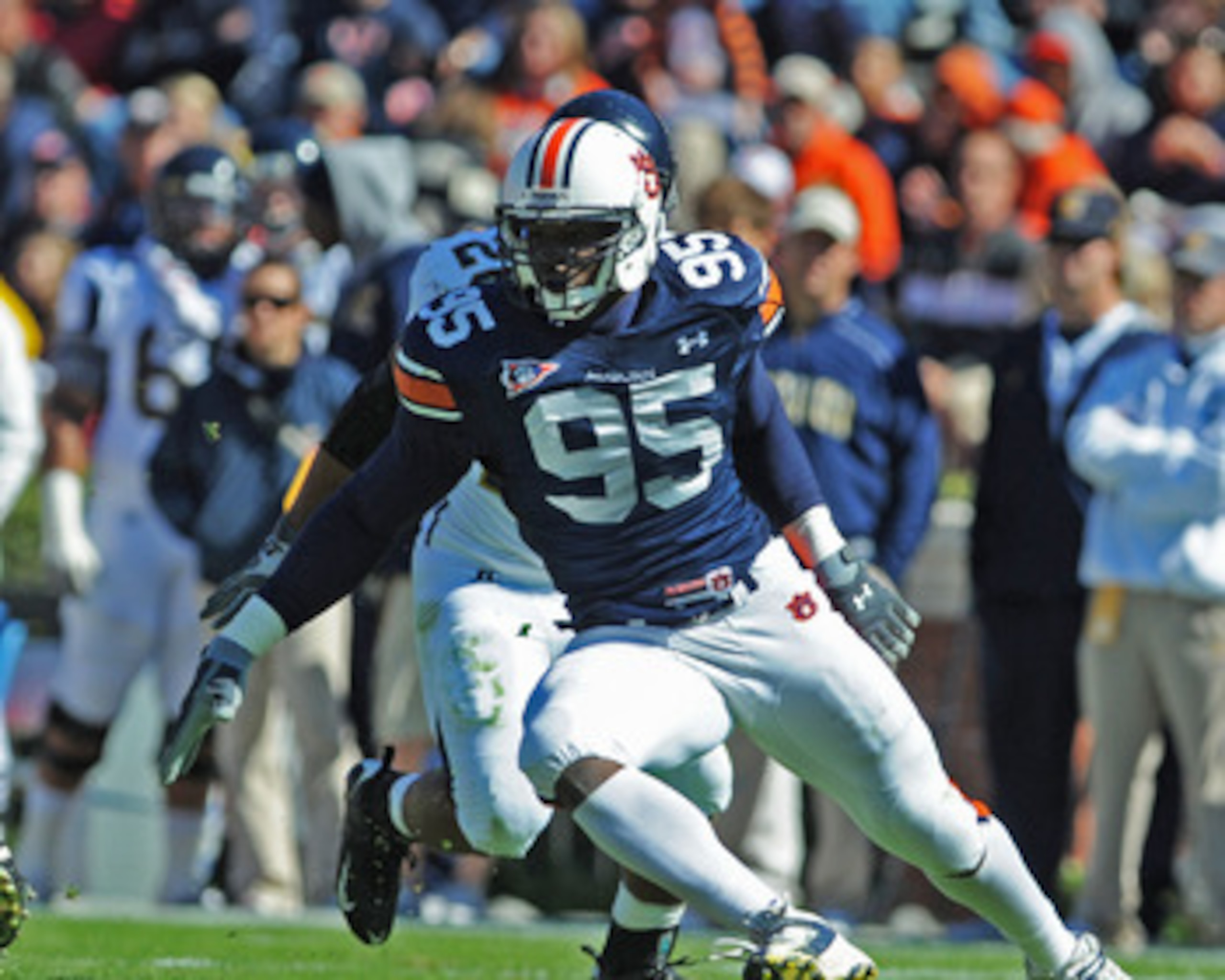 AUBURN, AL - NOVEMBER 06:  Defensive end Dee Ford #95 of the Auburn Tigers plays against the Chattanooga Mocs November 6, 2010 at Jordan-Hare Stadium in Auburn, Alabama.  (Photo by Al Messerschmidt/Getty Images)