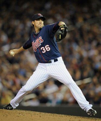 MINNEAPOLIS, MN - APRIL 12: Joe Nathan #36 of the Minnesota Twins pitches against the Kansas City Royals during the ninth inning of their game on April 12, 2011 at Target Field in Minneapolis, Minnesota. Twins defeated the Royals 4-3 in ten innings. (Phot