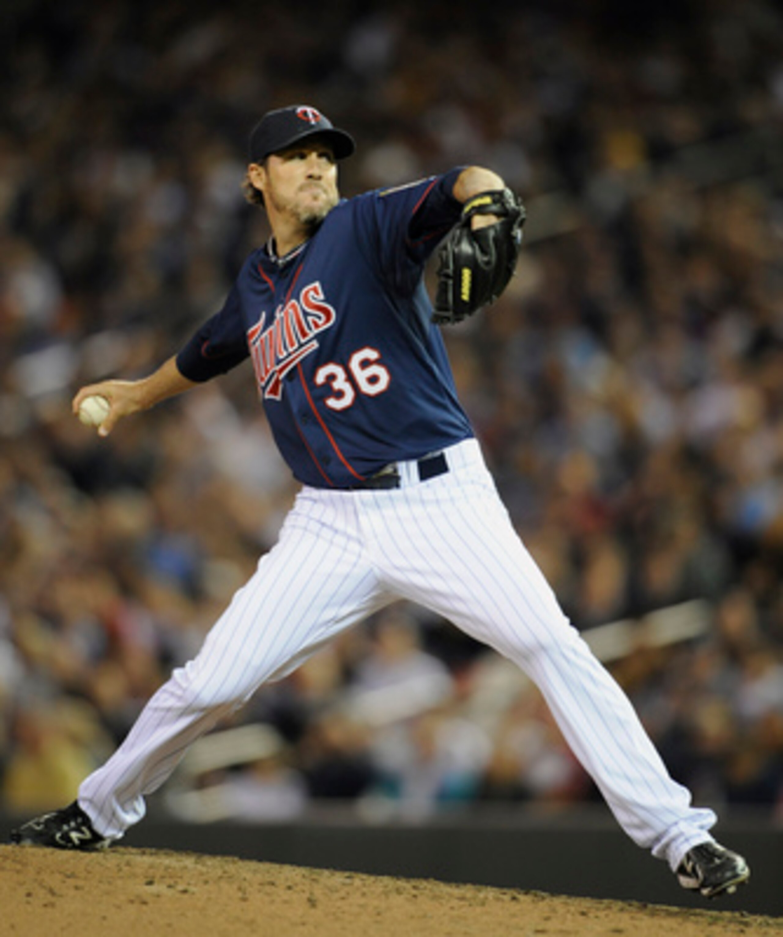 MINNEAPOLIS, MN - APRIL 12: Joe Nathan #36 of the Minnesota Twins pitches against the Kansas City Royals during the ninth inning of their game on April 12, 2011 at Target Field in Minneapolis, Minnesota. Twins defeated the Royals 4-3 in ten innings. (Phot