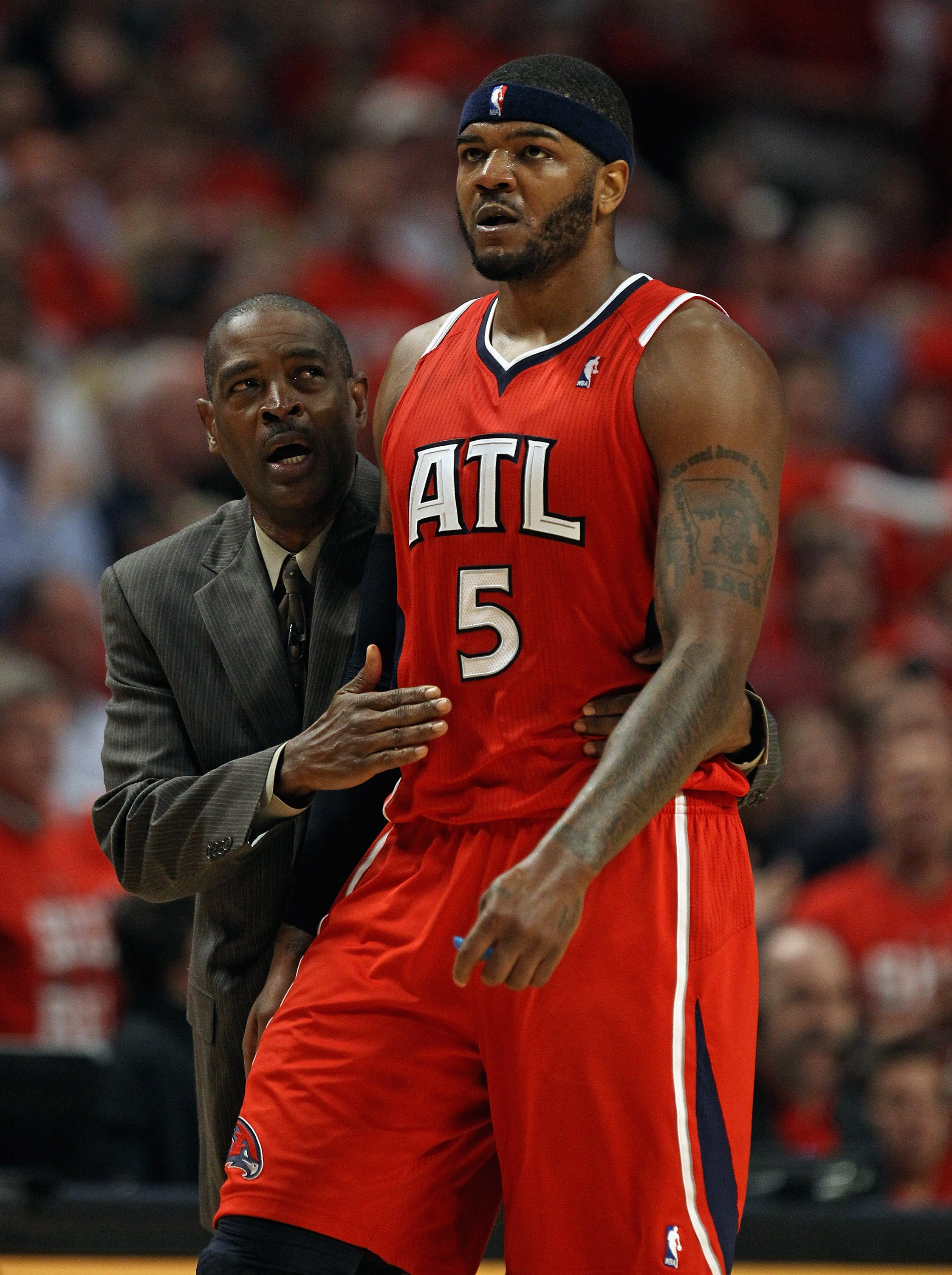 CHICAGO, IL - MAY 10: Head coach Larry Drew of the Atlanta Hawks walks down the court with Josh Smith #5 after an altercation against the Chicago Bulls in Game Five of the Eastern Conference Semifinals in the 2011 NBA Playoffs at the United Center on May