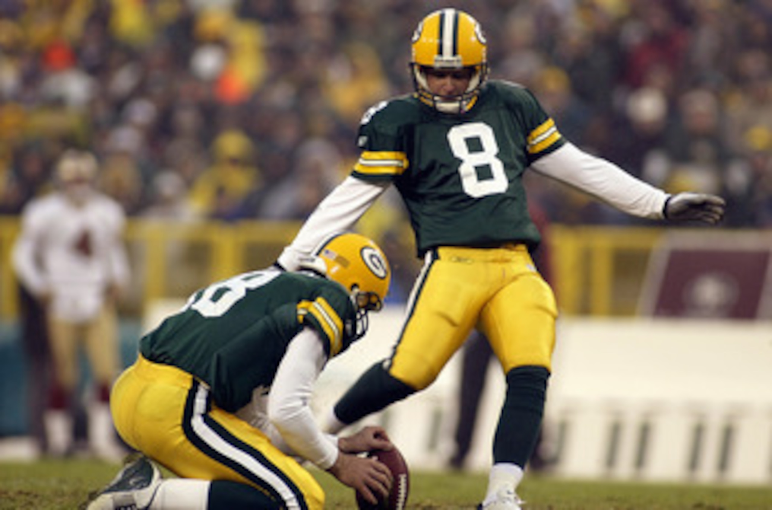 GREEN BAY, WI - November 23:  Kicker Ryan Longwell #8 of the Green Bay Packers kicks the ball during the game against the San Francisco 49ers on November 23, 2003 at Lambeau Field in Green Bay, Wisconsin.  The Pack defeated the Niners 20-10.  (Photo by Je