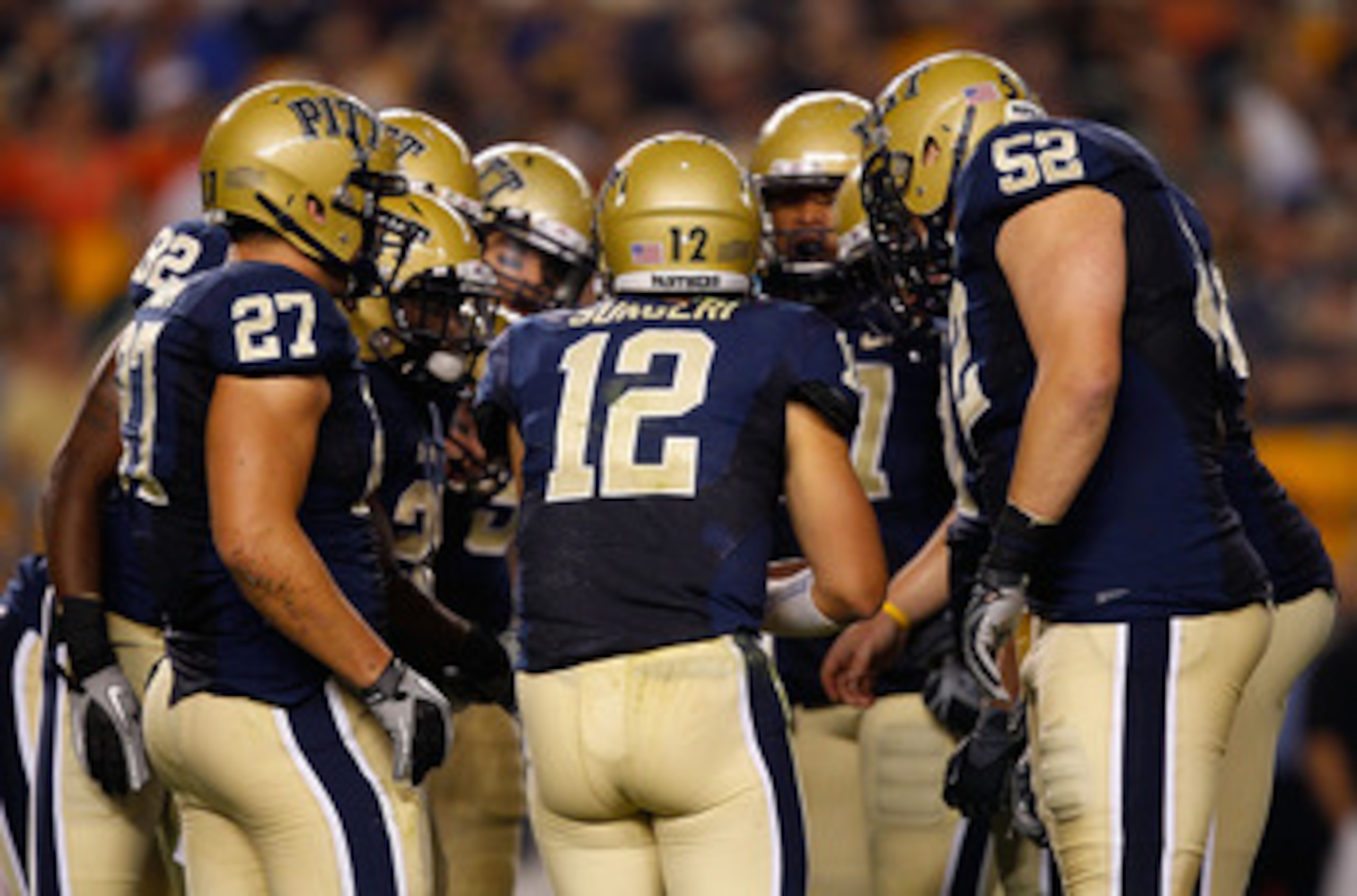 PITTSBURGH - SEPTEMBER 23:  Tino Sunseri #12 of the Pittsburgh Panthers calls a play in the huddle during the game against the Miami Hurricanes on September 23, 2010 at Heinz Field in Pittsburgh, Pennsylvania.  (Photo by Jared Wickerham/Getty Images)