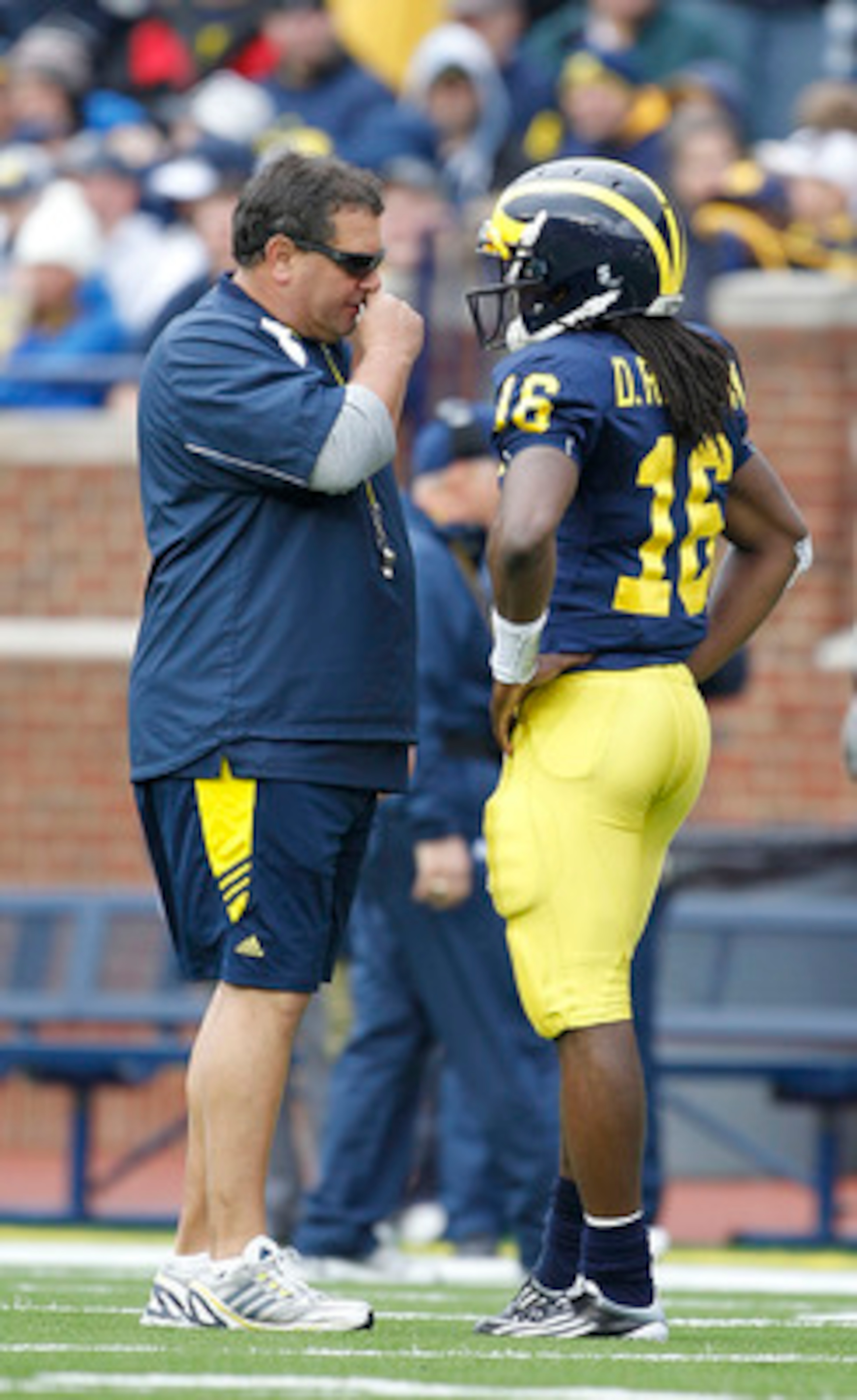 ANN ARBOR, MI - APRIL 16:  Head football coach Brady Hoke talks with Denard Robinson #16 during the annual Spring Game at Michigan Stadium on April 16, 2011 in Ann Arbor, Michigan.  (Photo by Leon Halip/Getty Images)