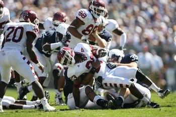 STATE COLLEGE, PA - SEPTEMBER 19: Wide receiver James Nixon #23 of the Temple Owls is tackled by defensive end Tom Golarz #39 of the Penn State Nittany Lions during a game on September 19, 2009 at Beaver Stadium in State College, Pennsylvania. (Photo by H