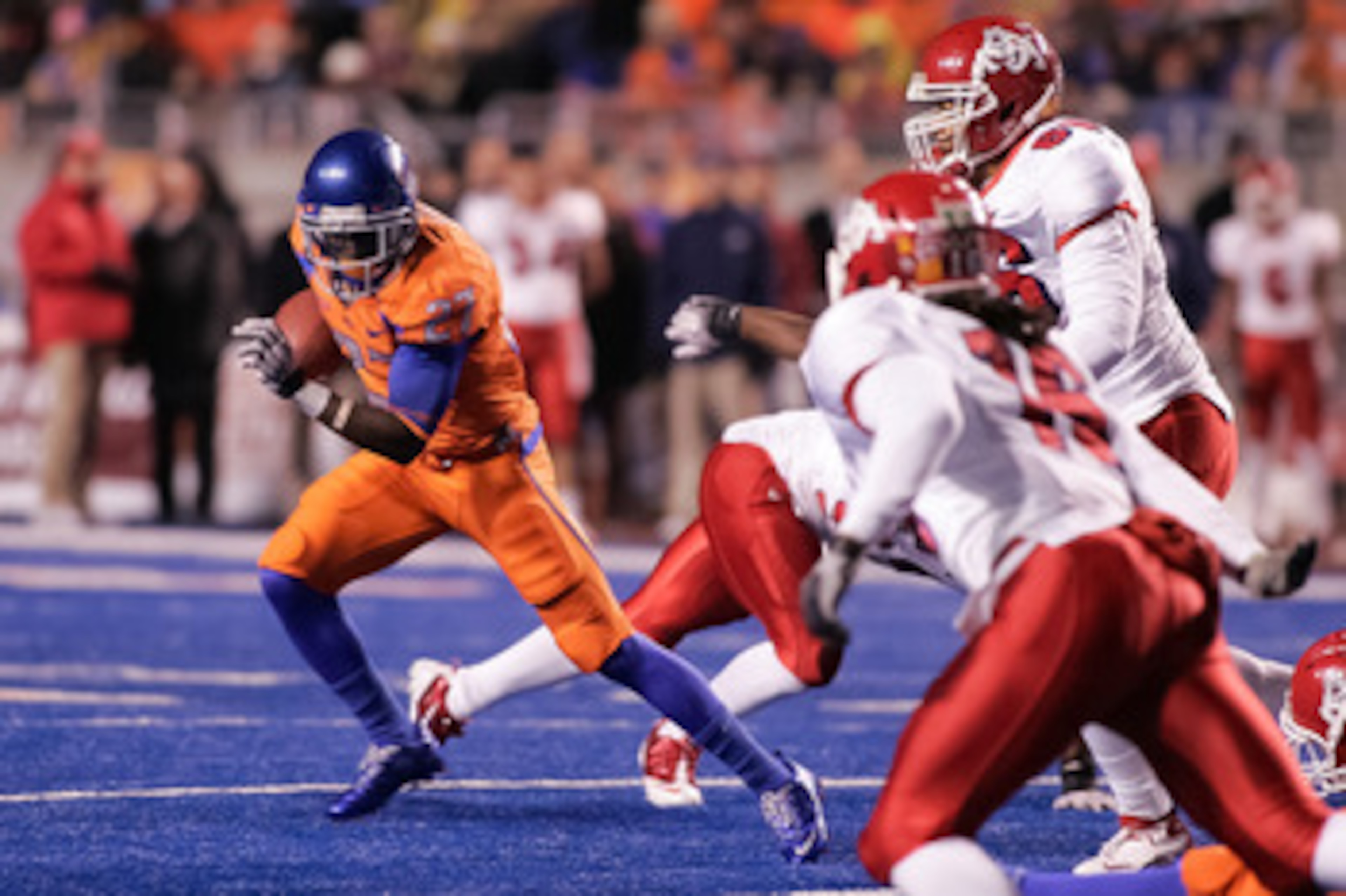 BOISE, ID - NOVEMBER 19:  Jeremy Avery #27 of the Boise State Broncos runs the ball against the Fresno State Bulldogs at Bronco Stadium on November 19, 2010 in Boise, Idaho.  (Photo by Otto Kitsinger III/Getty Images)
