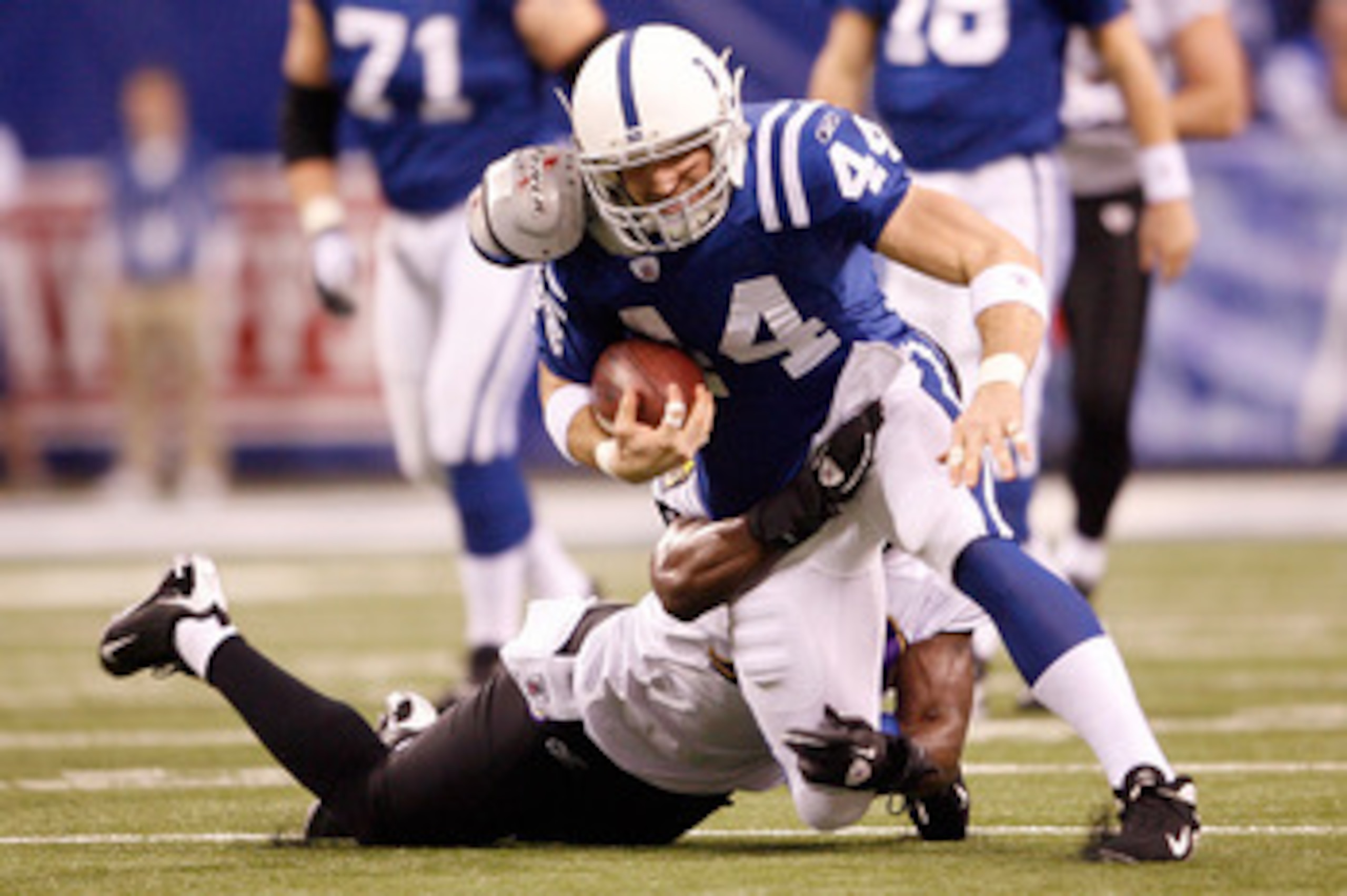 INDIANAPOLIS - JANUARY 16:  Tight end Dallas Clark #44 of the Indianapolis Colts is tackled after a first quarter catch against the Baltimore Ravens in the AFC Divisional Playoff Game at Lucas Oli Stadium on January 16, 2010 in Indianapolis, Indiana.  (Ph