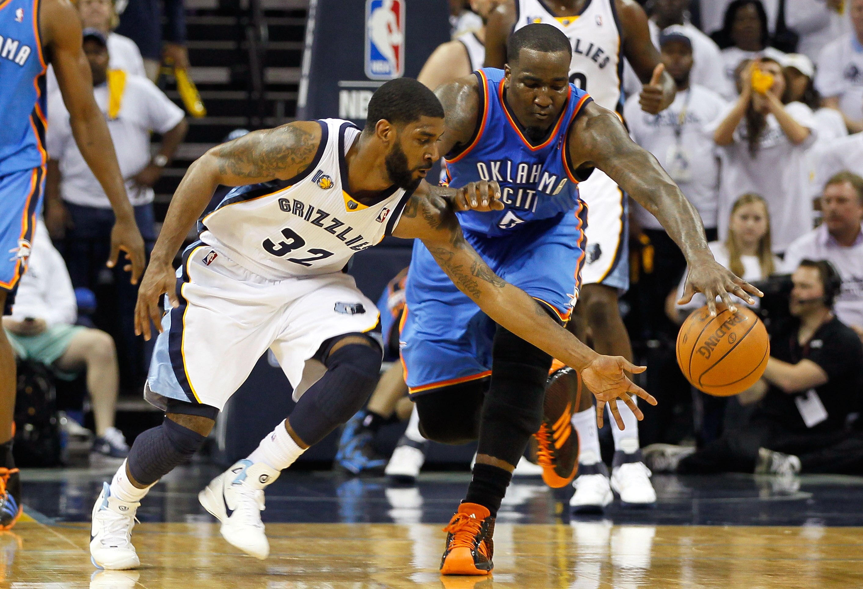 MEMPHIS, TN - MAY 13:  O.J. Mayo #32 of the Memphis Grizzlies battles for a loose ball against Kendrick Perkins #5 of the Oklahoma City Thunder in Game Six of the Western Conference Semifinals in the 2011 NBA Playoffs at FedExForum on May 13, 2011 in Memp