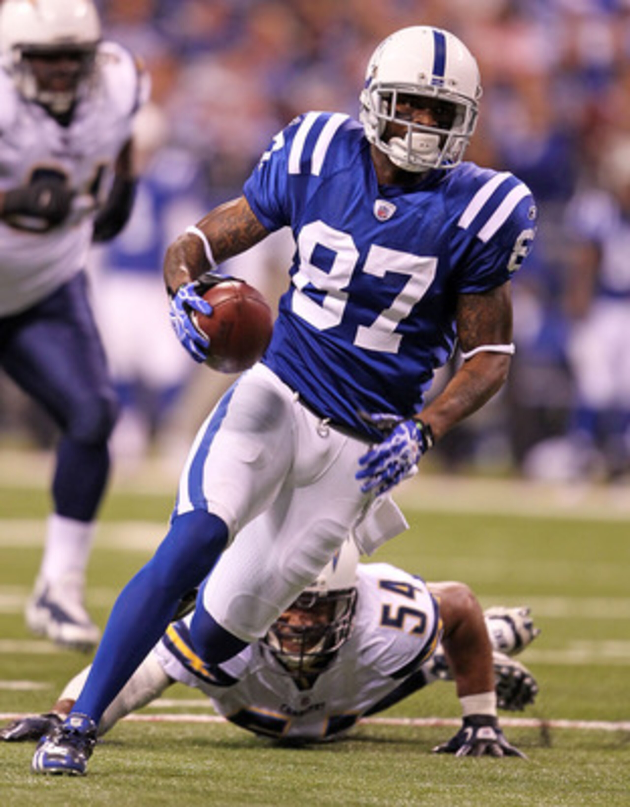 INDIANAPOLIS - NOVEMBER 28: Reggie Wayne #87 of the Indianapolis Colts runs with the ball during the NFL game against the San Diego Chargers at Lucas Oil Stadium on November 28, 2010 in Indianapolis, Indiana.  (Photo by Andy Lyons/Getty Images)