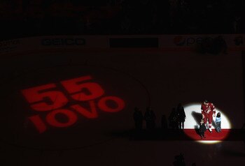 GLENDALE, AZ - JANUARY 08:  Ed Jovanovski #55 of the Phoenix Coyotes stands on the ice with his kids as he is honored for his 1000th game before the start of the NHL game against the Buffalo Sabres at Jobing.com Arena on January 8, 2011 in Glendale, Arizo