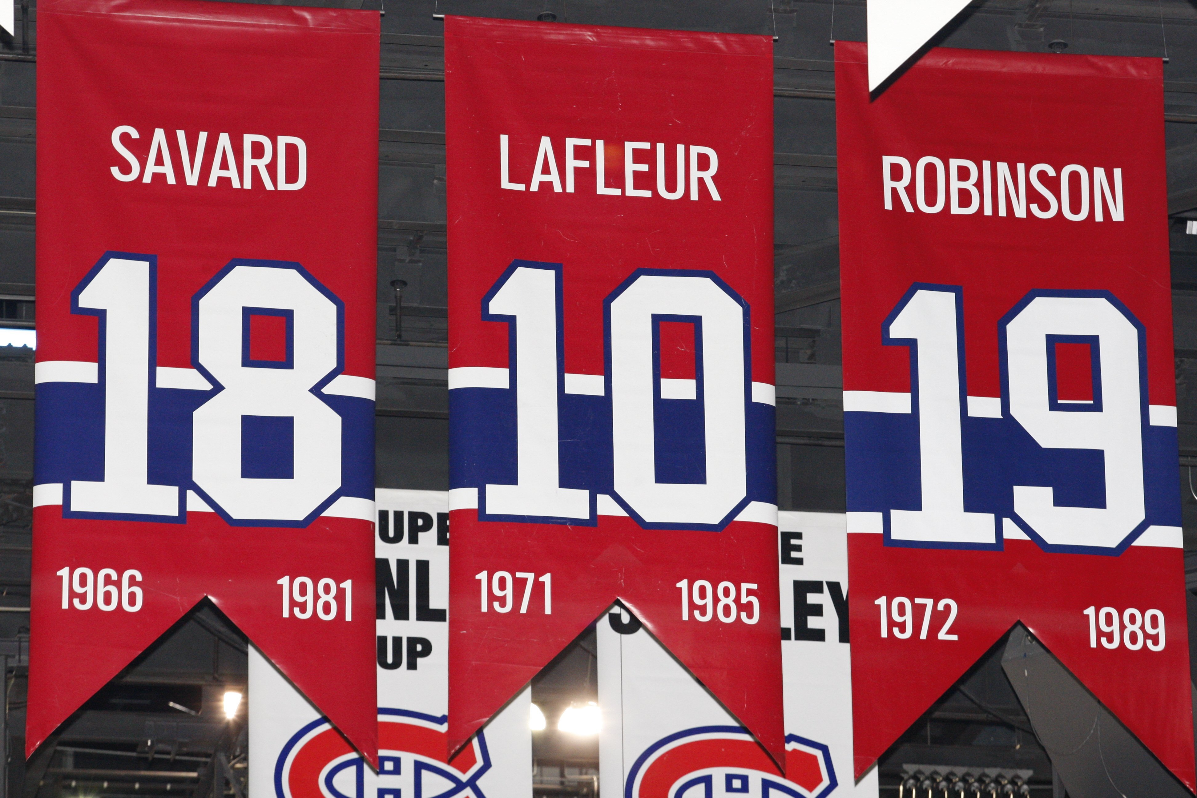 MONTREAL- APRIL 19: A photo of the banners commemorating the retired jerseys of Serge Savard, Guy Lafleur and Larry Robinson hanging in the Bell Centre prior to Game Three of the Eastern Conference Quarterfinals between the Washington Capitals and Montre MONTREAL- APRIL 19: A photo of the banners commemorating the retired jerseys of Serge Savard, Guy Lafleur and Larry Robinson hanging in the Bell Centre prior to Game Three of the Eastern Conference Quarterfinals between the Washington Capitals and Montre