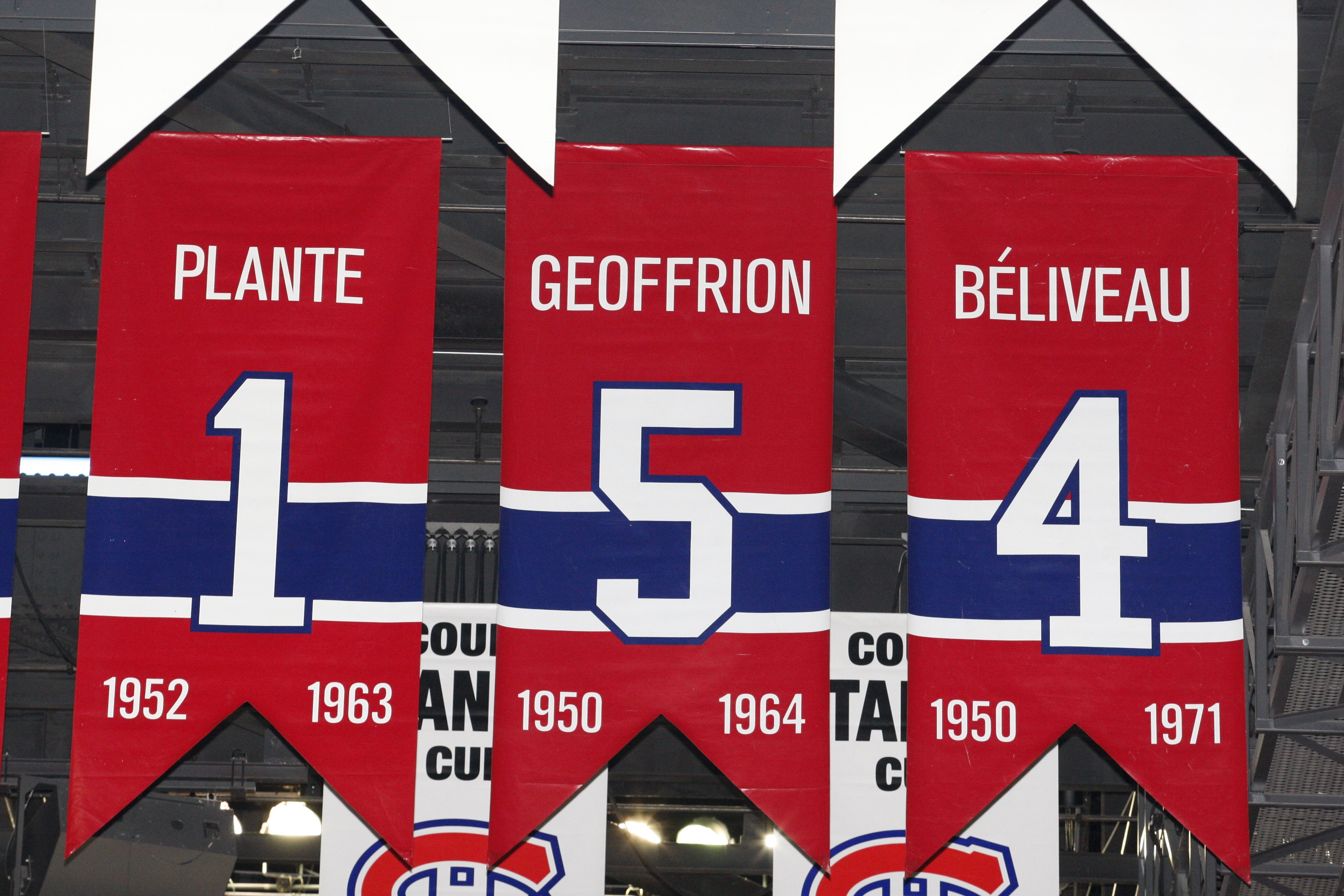 MONTREAL- APRIL 19: A photo of the banners commemorating the retired jerseys of Jacque Plante, Bernard Geoffrion and Jean Beliveau hanging in the Bell Centre prior to Game Three of the Eastern Conference Quarterfinals between the Washington Capitals and MONTREAL- APRIL 19: A photo of the banners commemorating the retired jerseys of Jacque Plante, Bernard Geoffrion and Jean Beliveau hanging in the Bell Centre prior to Game Three of the Eastern Conference Quarterfinals between the Washington Capitals and