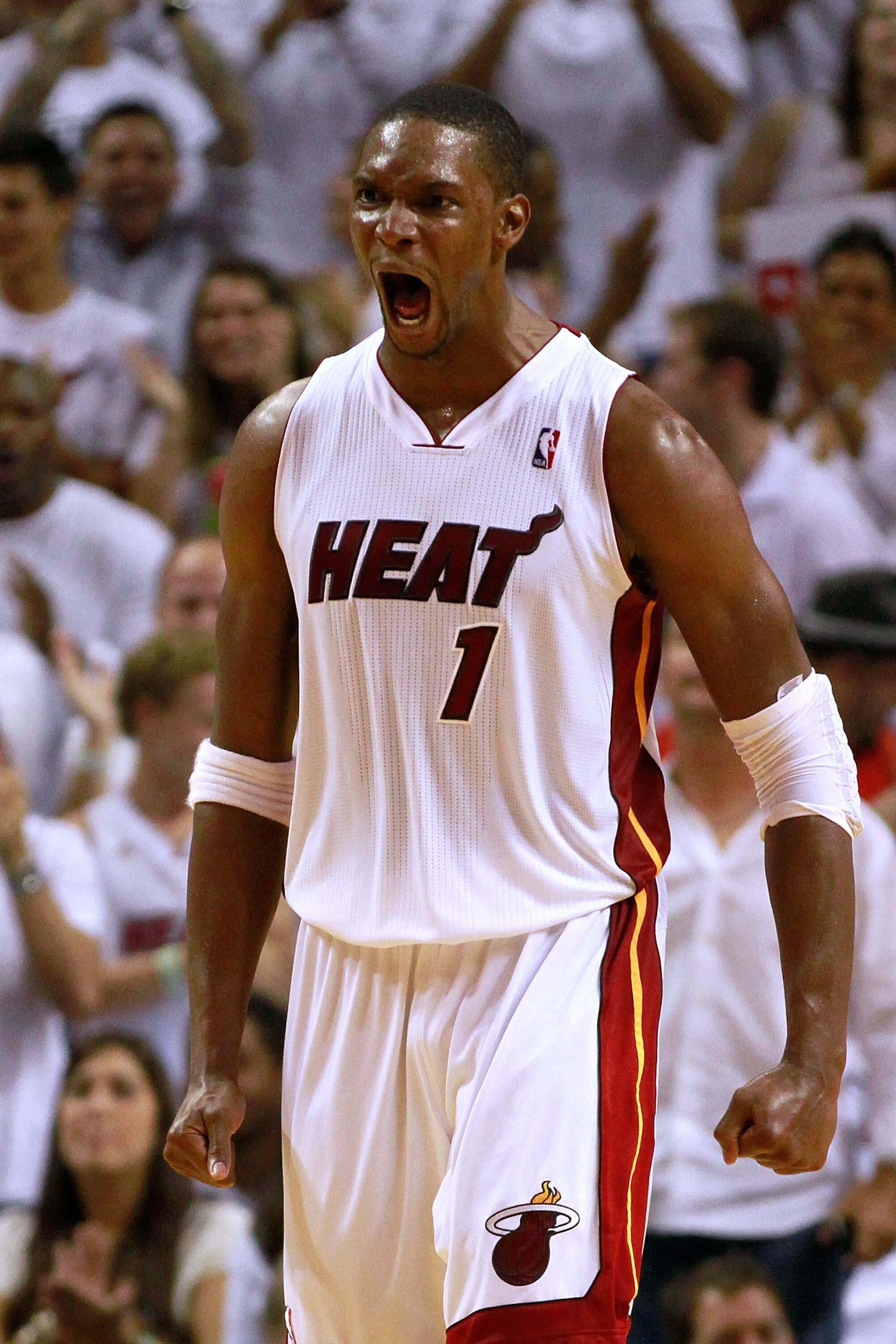 MIAMI, FL - MAY 22:  Chris Bosh #1 of the Miami Heat reacts in the fourth quarter against the Chicago Bulls in Game Three of the Eastern Conference Finals during the 2011 NBA Playoffs on May 22, 2011 at American Airlines Arena in Miami, Florida.  NOTE TO 