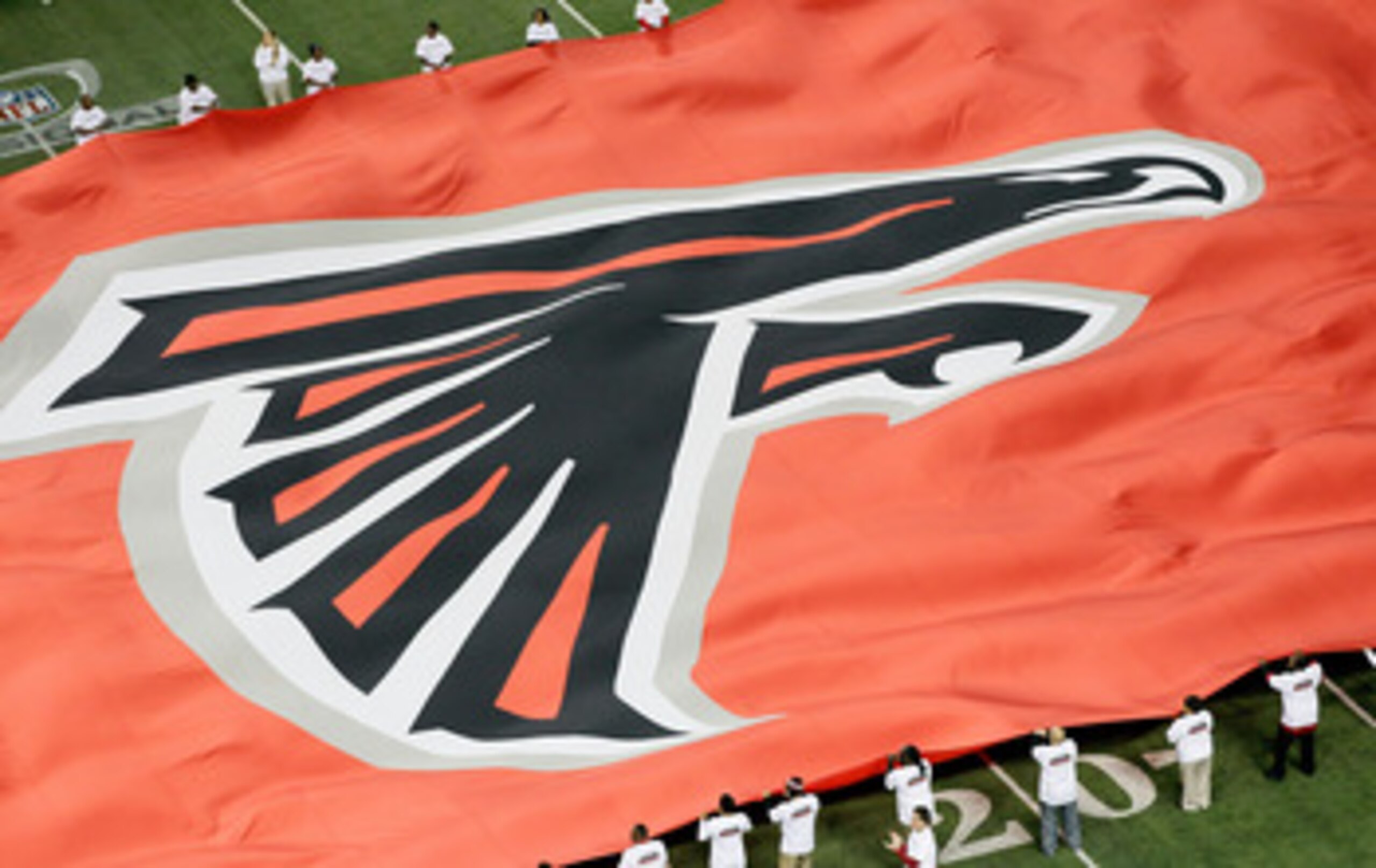 ATLANTA, GA - JANUARY 15:  A giant flag with the Atlanta Falcons logo is seen on the field against the Green Bay Packers during their 2011 NFC divisional playoff game at Georgia Dome on January 15, 2011 in Atlanta, Georgia.  (Photo by Kevin C. Cox/Getty I