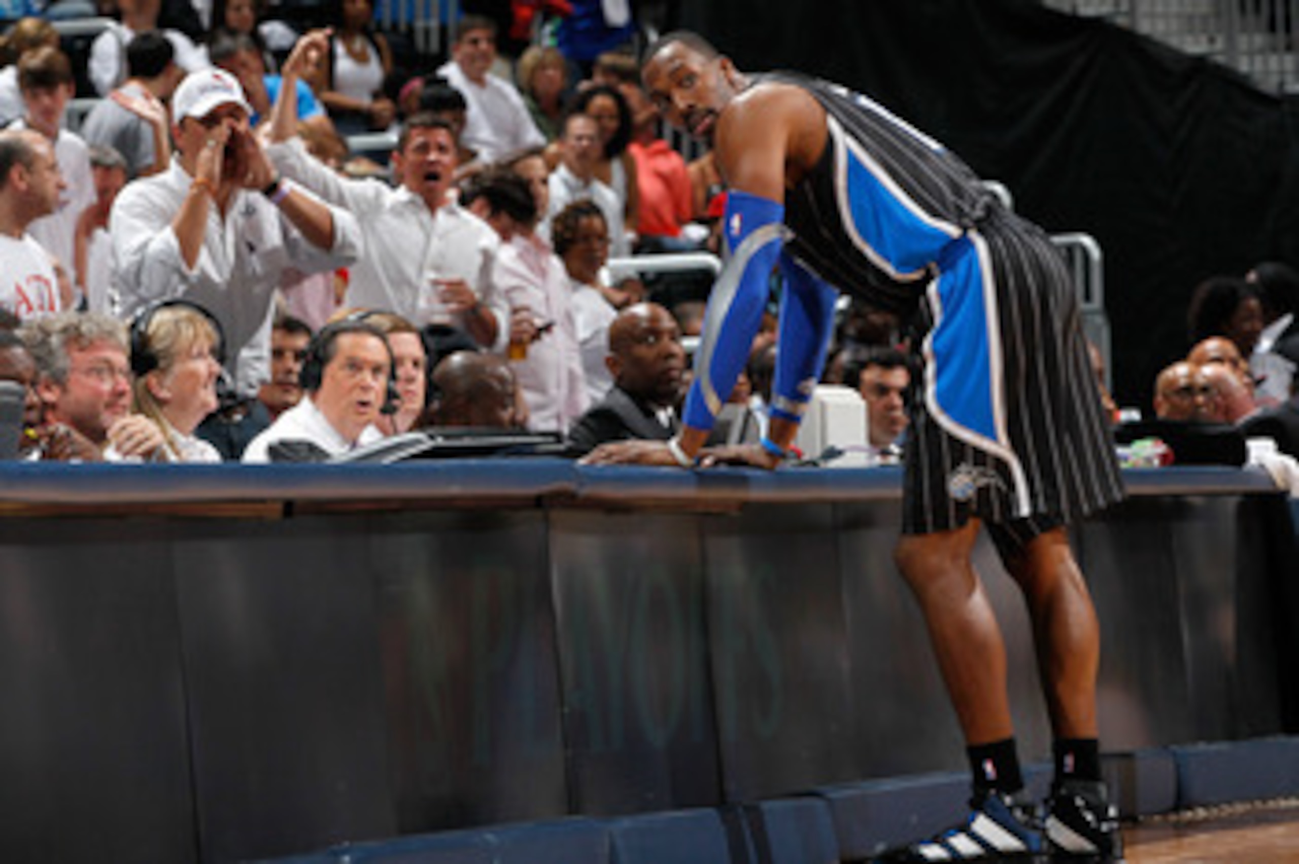 ATLANTA, GA - APRIL 28:  Dwight Howard #12 of the Orlando Magic stands at the scorer's table after being earning a technical foul against Zaza Pachulia #27 of the Atlanta Hawks during Game Six of the Eastern Conference Quarterfinals in the 2011 NBA Playof
