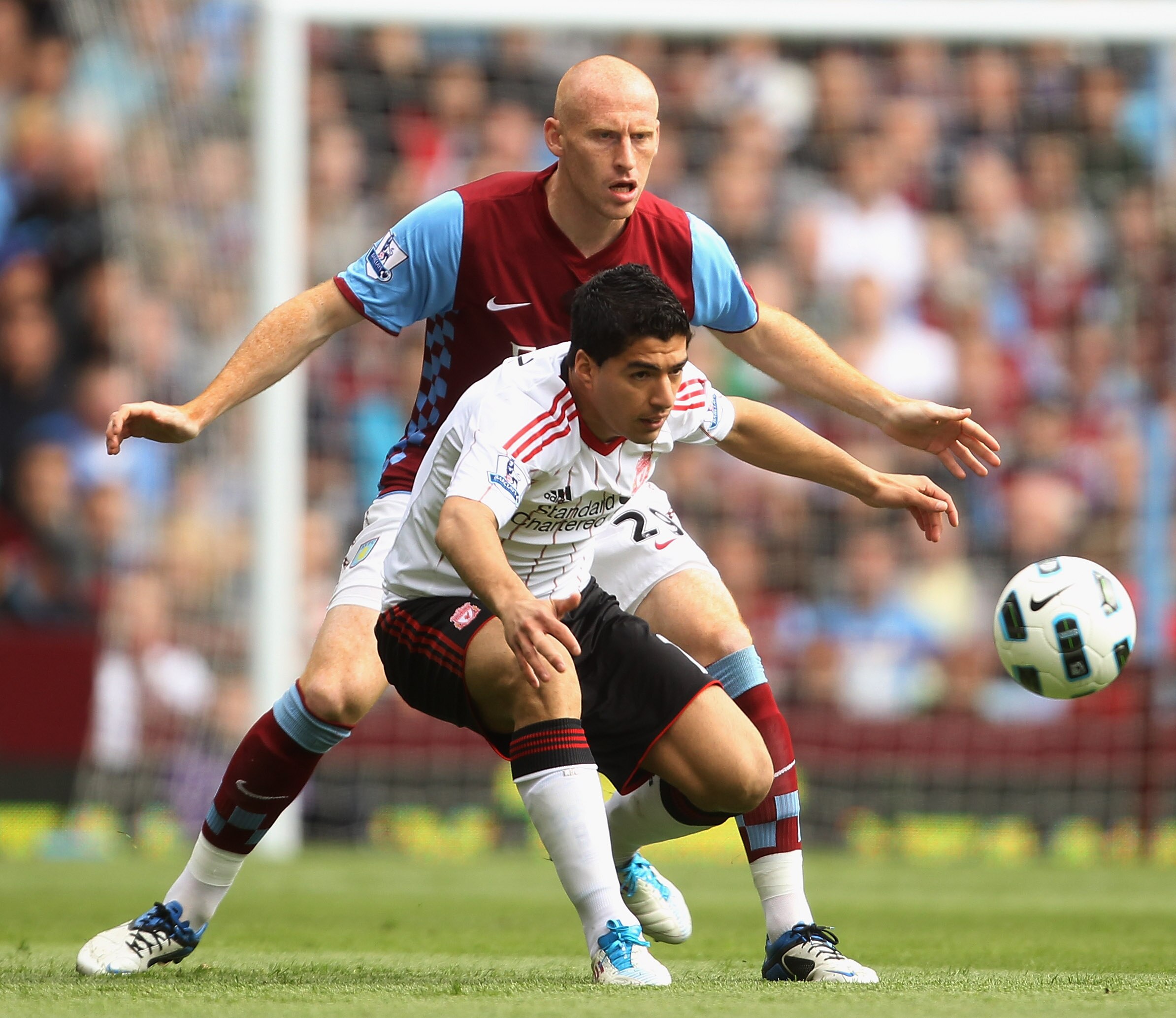 BIRMINGHAM, ENGLAND - MAY 22:  Luis Suarez of Liverpool battles with James Collins of Aston Villa during the Barclays Premier League match between Aston Villa and Liverpool at Villa Park on May 22, 2011 in Birmingham, England.  (Photo by Bryn Lennon/Getty