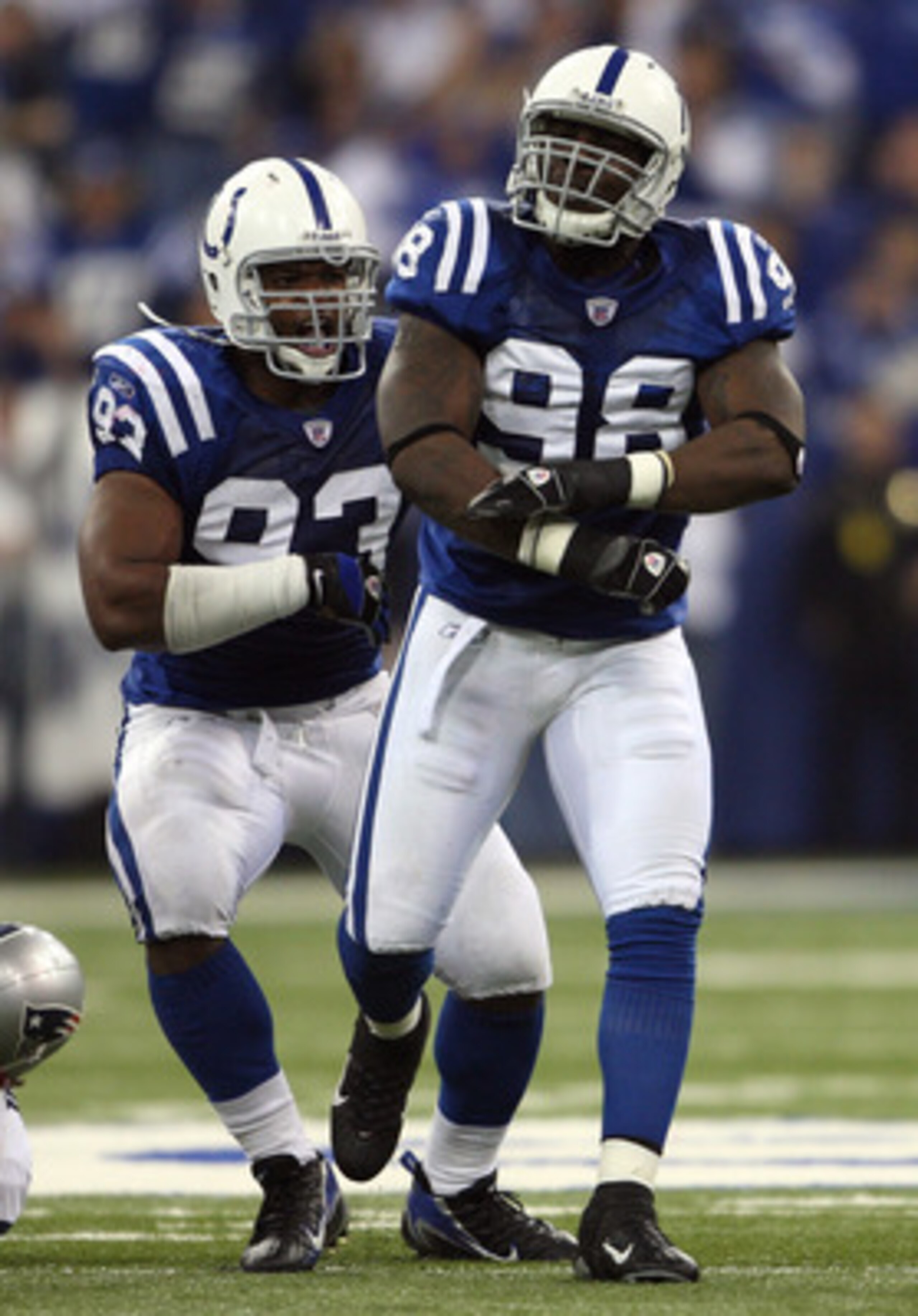 INDIANAPOLIS - NOVEMBER 04:  Robert Mathis #98 and Dwight Freeney #93 of the Indianapolis Colts react after Mathis sacked Tom Brady #12 of the New England Patriots in the third quarter of their game on November 4, 2007 at the RCA Dome in Indianapolis, Ind