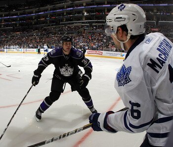 LOS ANGELES, CA - JANUARY 10: Willie Mitchell #33 of the Los Angeles Kings lines up Clarke MacArthur #16 of the Toronto Maple Leafs at the Staples Center on January 10, 2011 in Los Angeles, California. The Leafs defeated the Kings 3-2. (Photo by Bruce Ben